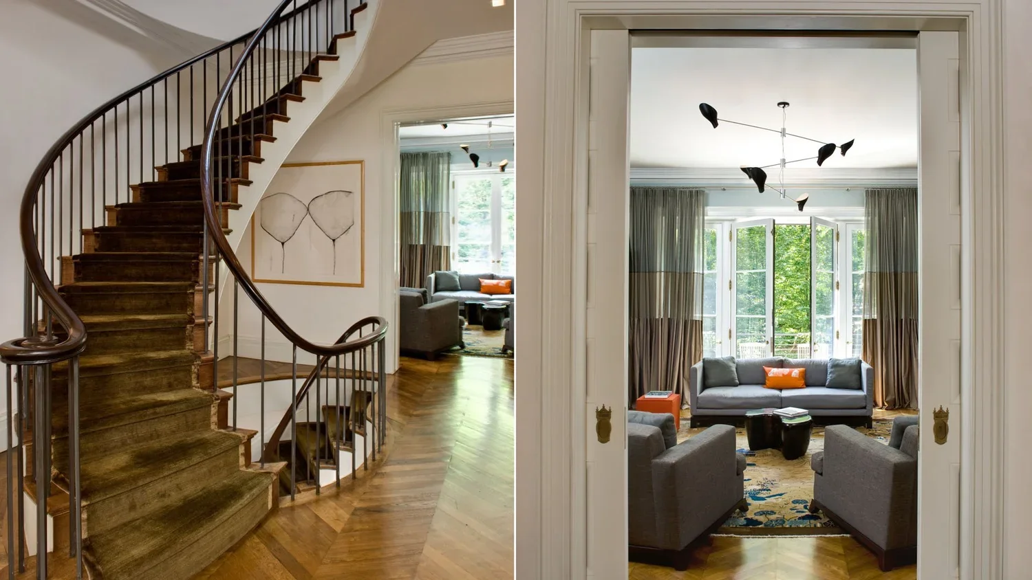 A split view of a home interior: on the left, a wooden curved staircase with black metal railing and a painting of two abstract faces on the wall; on the right, a living room viewed through a wide doorway, featuring a gray sofa, four gray armchairs, 
