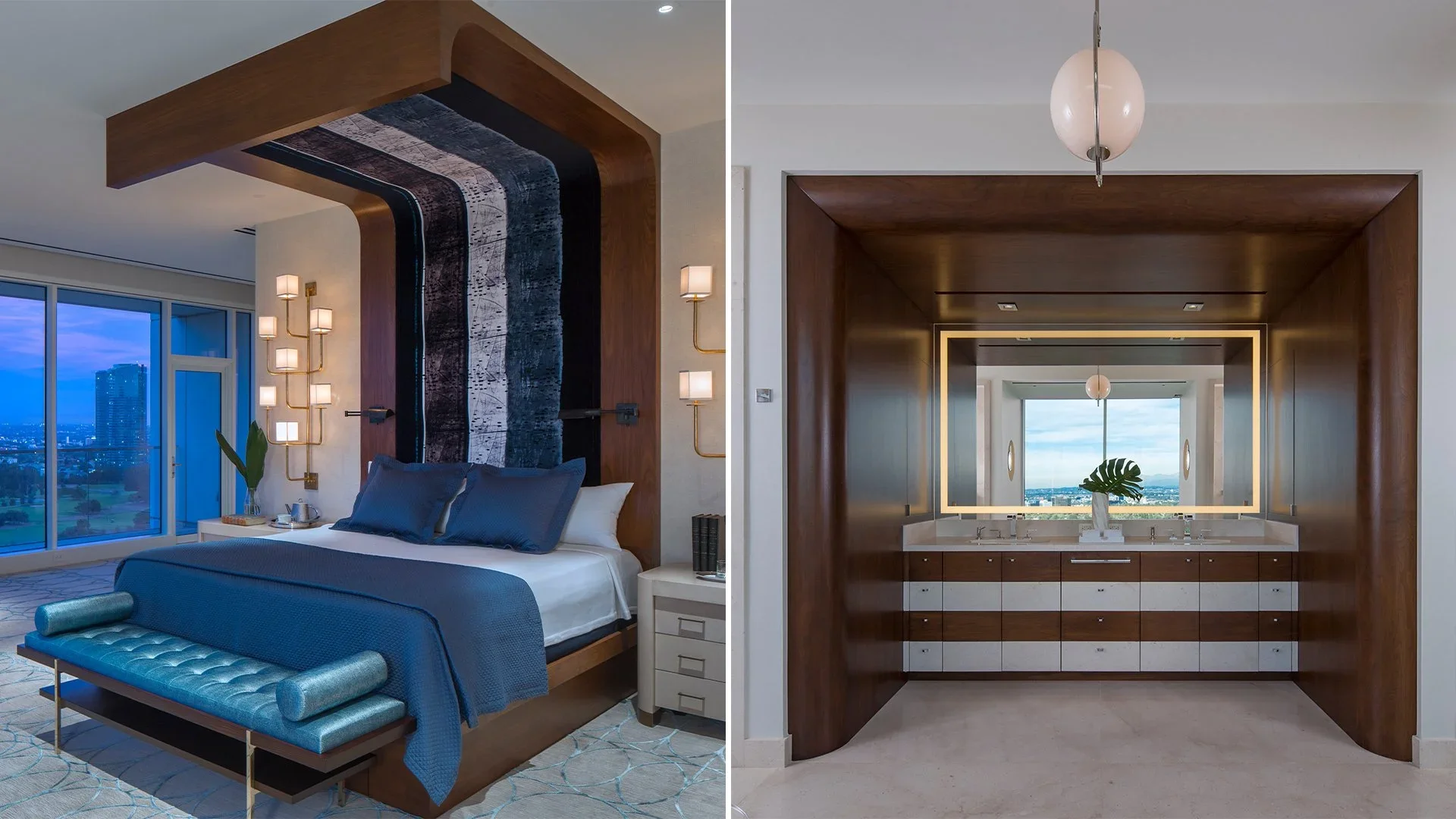 Side-by-side view of a modern bedroom and bathroom with wood accents. The bedroom features a bed with blue bedding, a blue bench at the foot, wall sconces, and a large window with a city view. The bathroom area has a wide mirror, double sinks, and a 