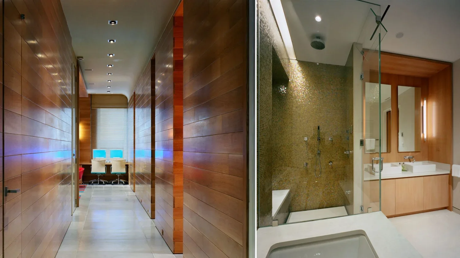 A modern bathroom with a glass shower enclosure on the right, wooden cabinetry, and a double sink vanity with mirrors, and a hallway with wooden walls leading to a room with two chairs and a window with blinds.