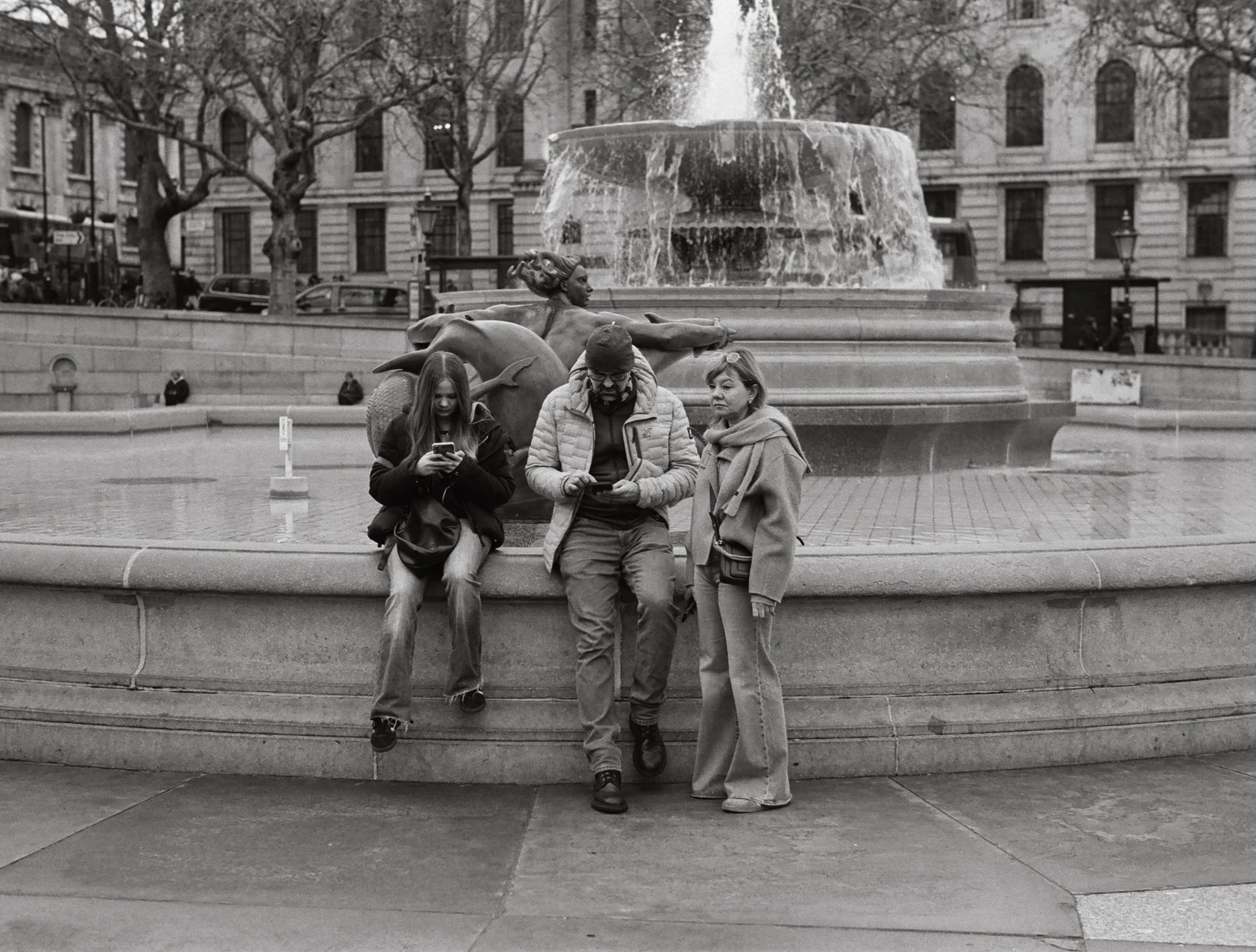 By a fountain, Trafalgar Square.