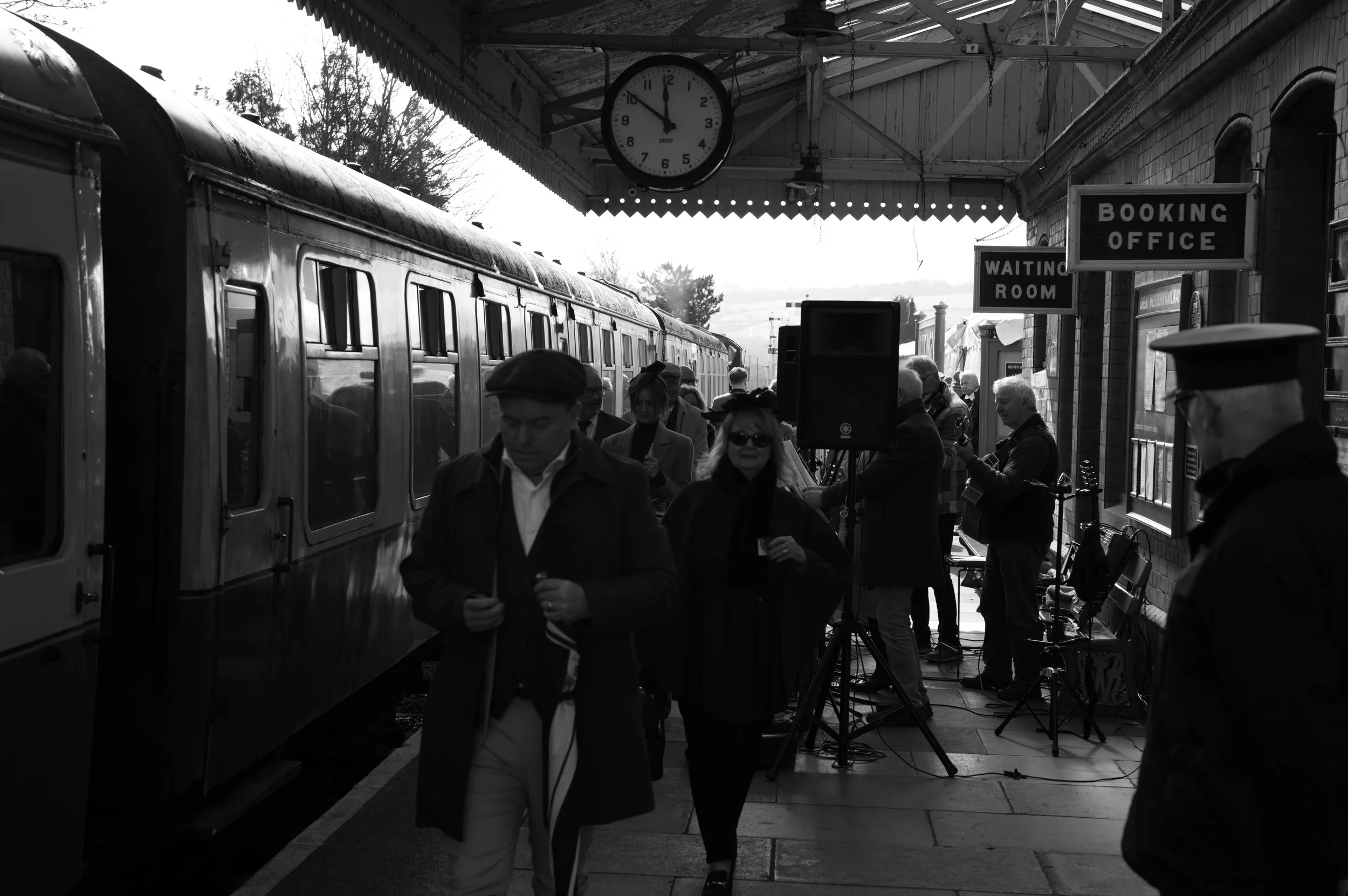 Racegoers arriving, looking for their carriage.
