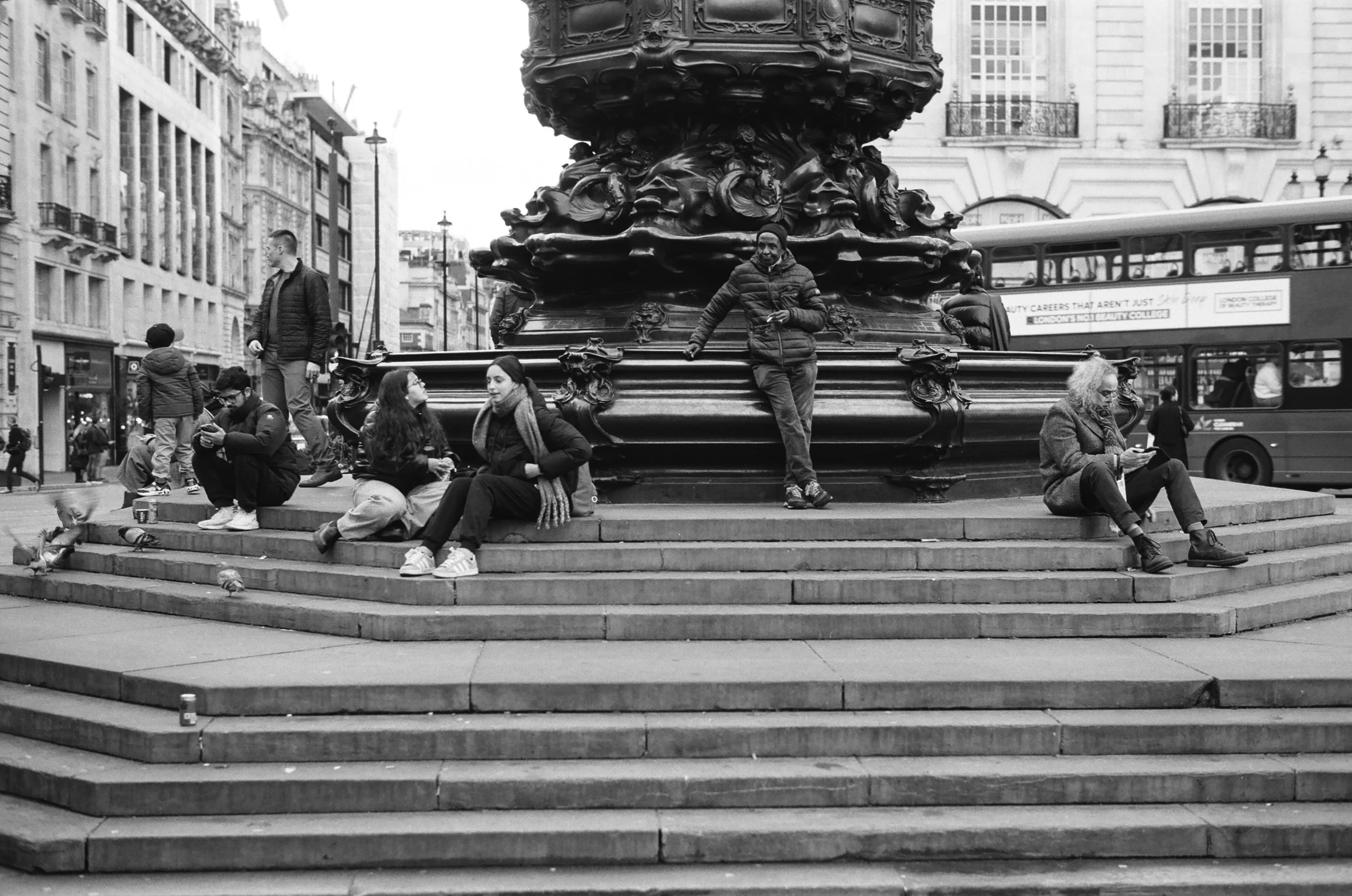 Relaxing by Eros, Piccadilly Circus.