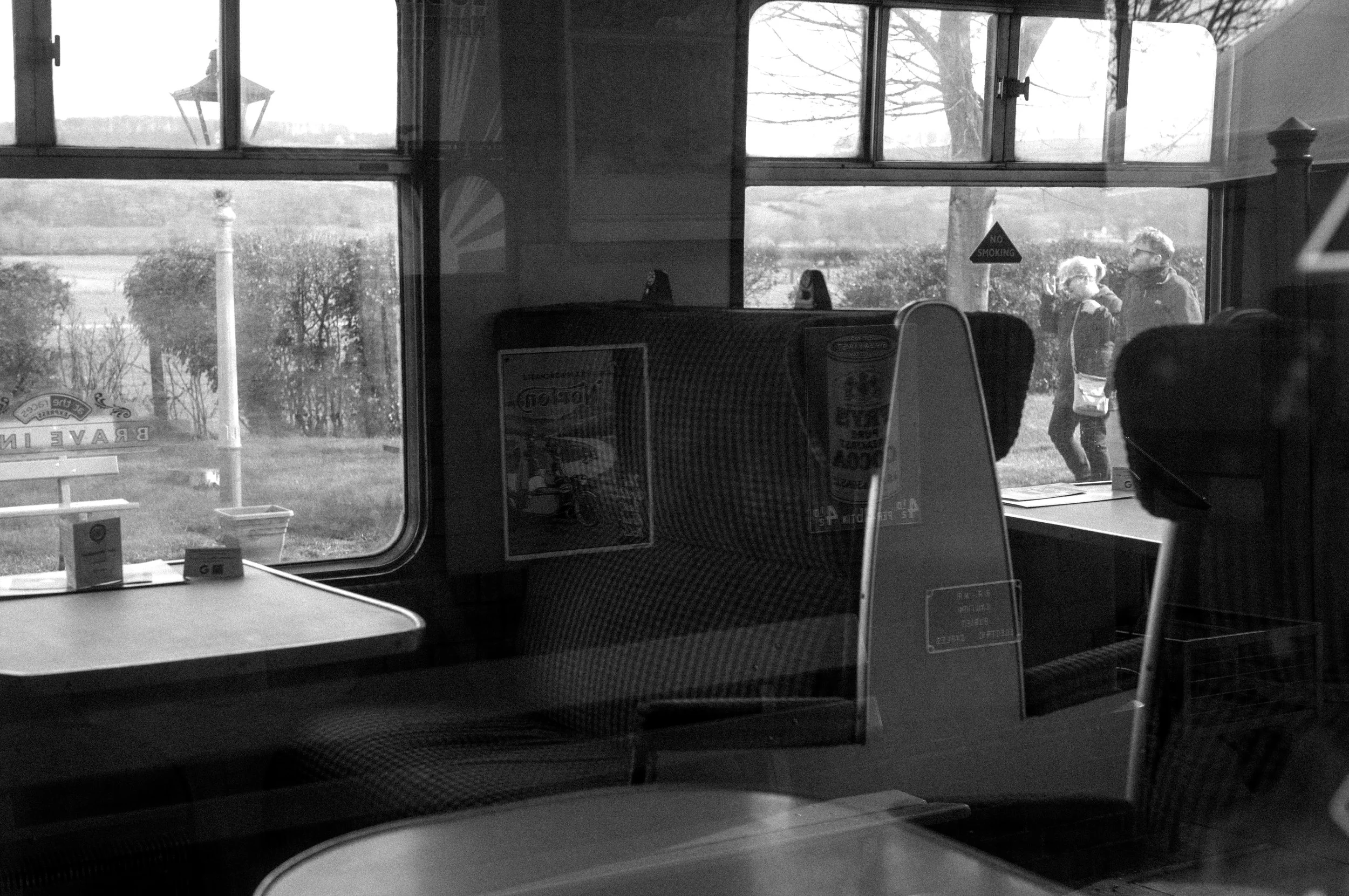 A view through the window of an old style carriage. 