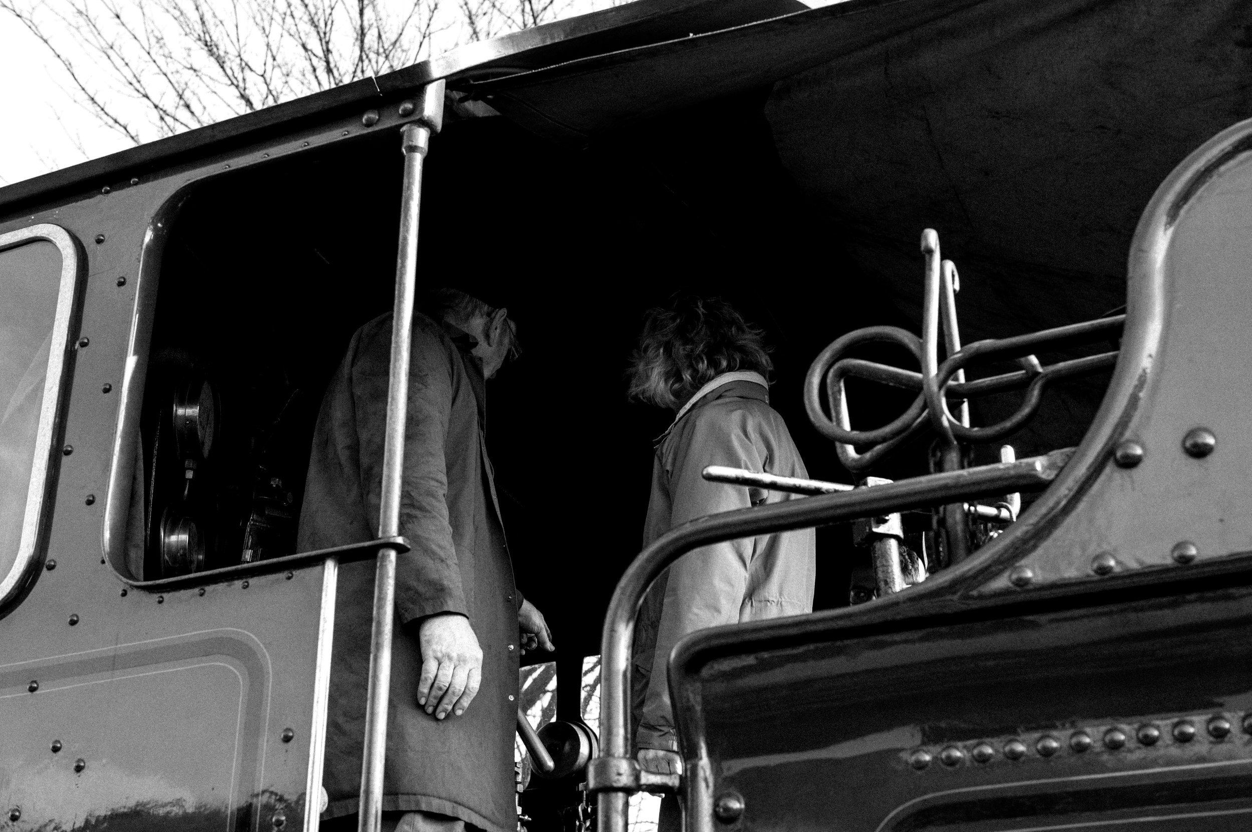 Showing someone around the cab.