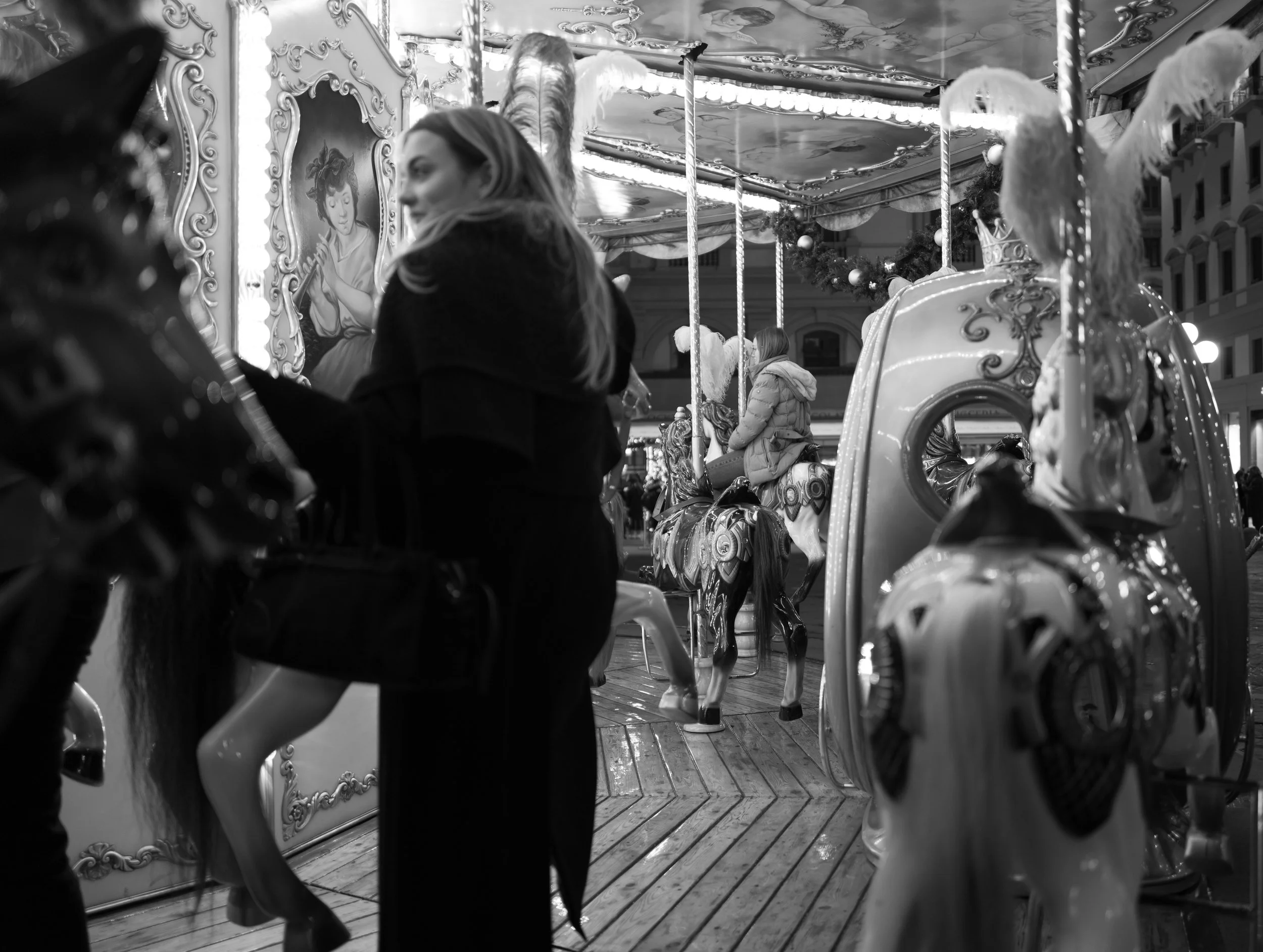 Riders on the merry-go-round, Florence.