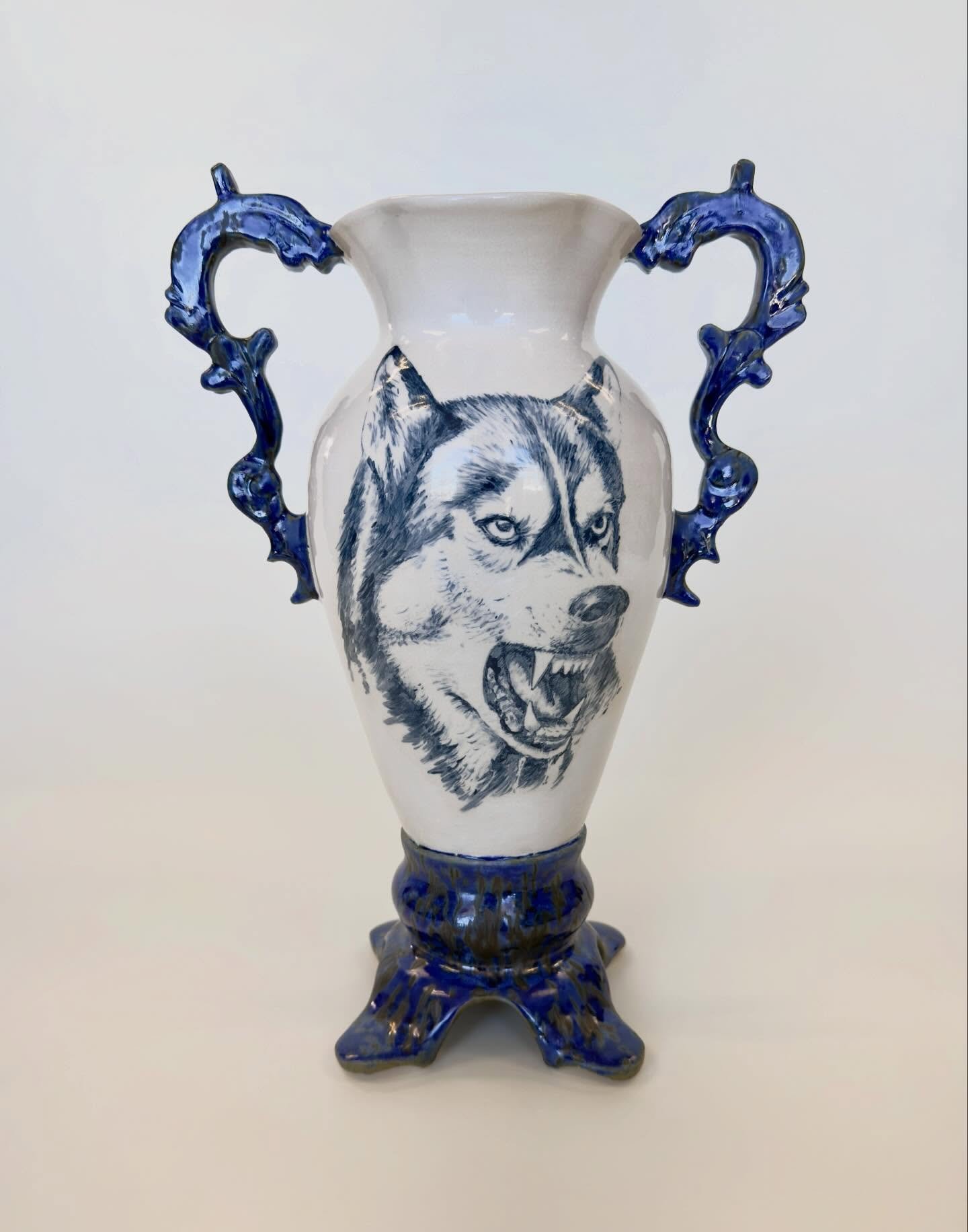 Husky &amp; crossbow, ceramic vase.