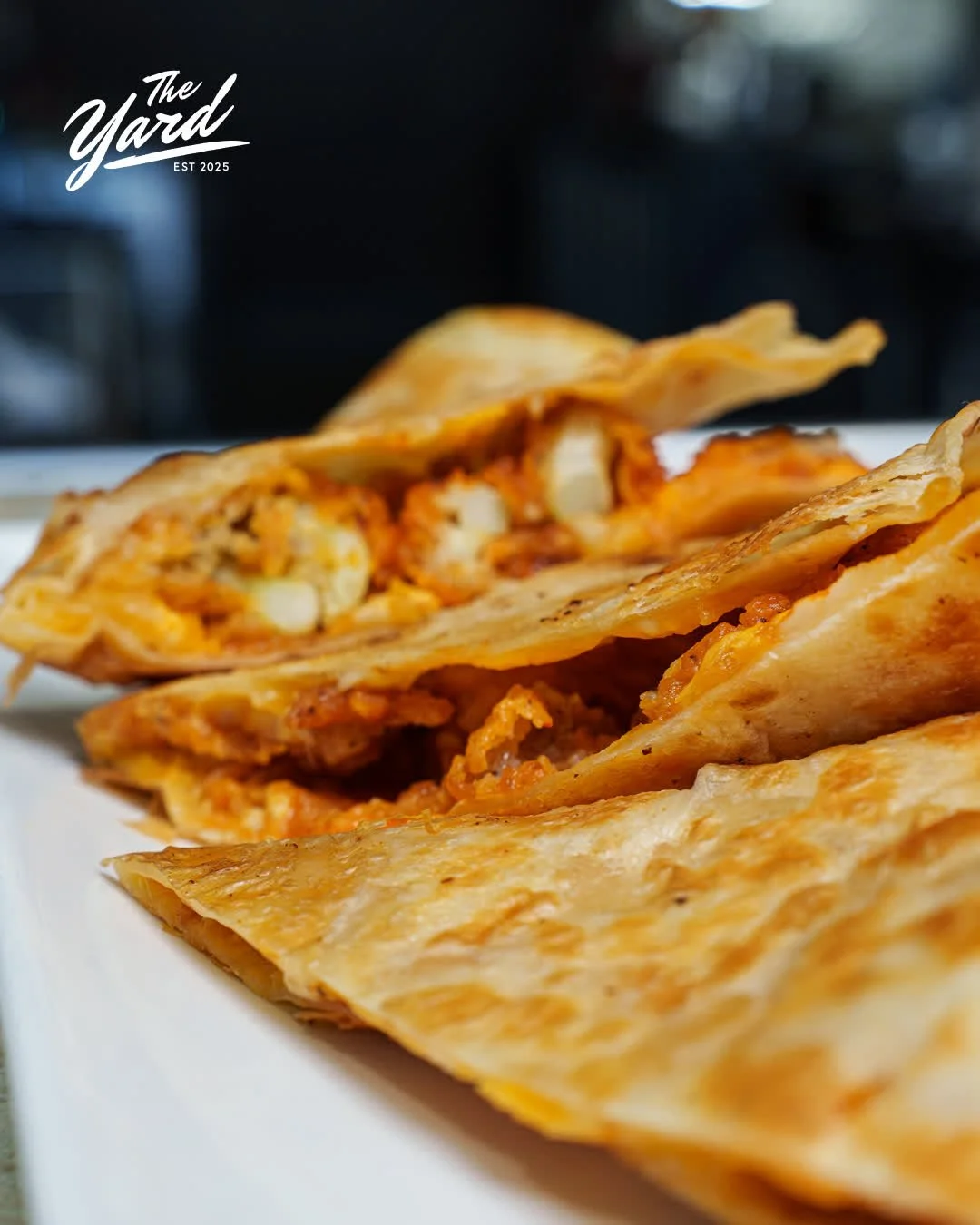 Buffalo chicken, melted cheese, grilled to golden perfection. Warning: you might not want to share. #TheYardCola #BarEats #ColumbiaEats #Quesadilla