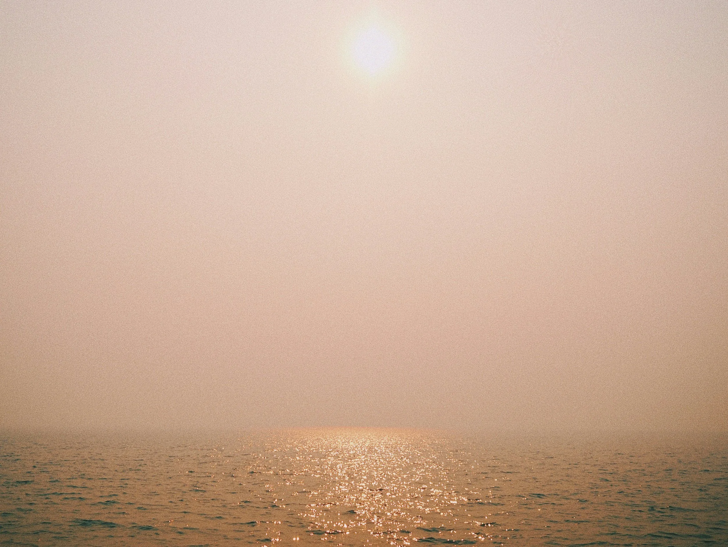 Calm sunrise over the ocean, symbolizing hope and self-compassion