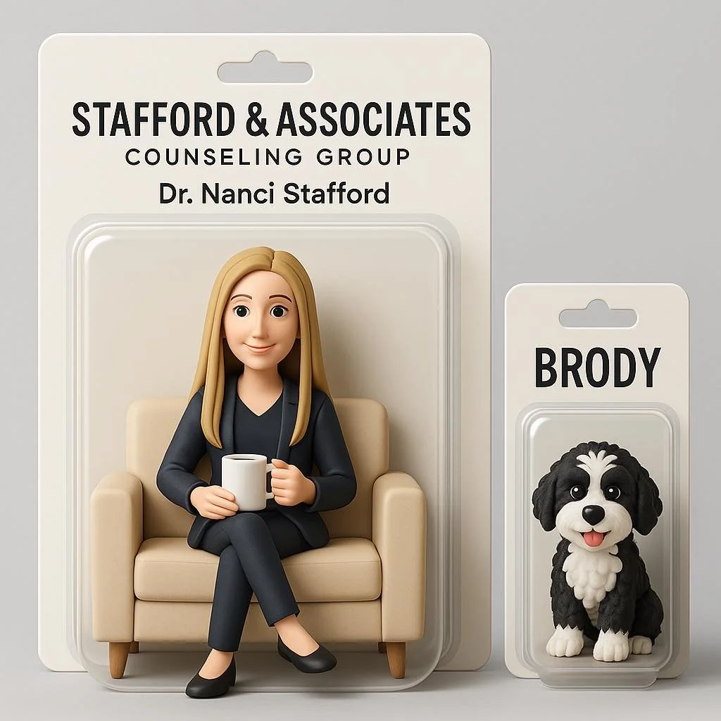 A collectible figurine of Dr. Nanci Stafford from Stafford & Associates Counseling Group, seated on a beige couch, holding a coffee mug. Beside her is a smaller figurine of a black and white dog named Brody in a clear display case.