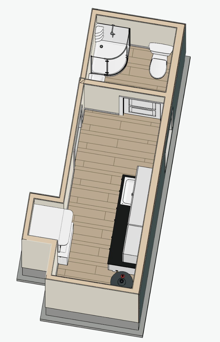 Floor plan of a small apartment with a living area, kitchenette, and a separate bathroom with a shower and toilet.