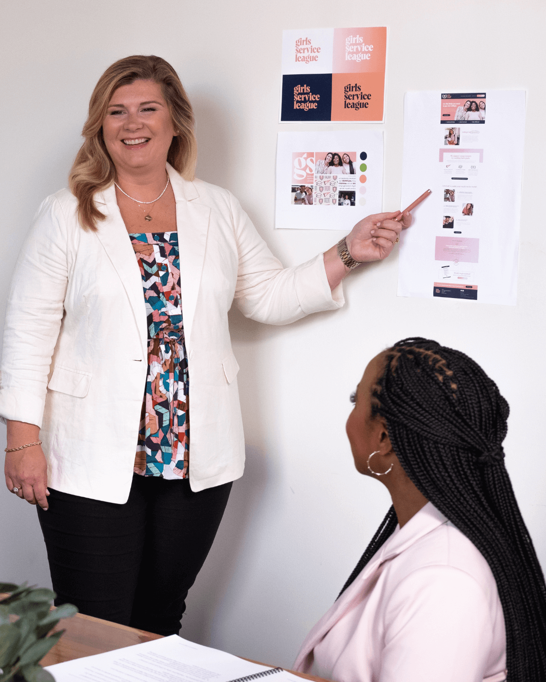 Lauren Cockerell presents brand concepts to a client during a strategy meeting, advising on messaging and visual direction for a PR and marketing campaign.