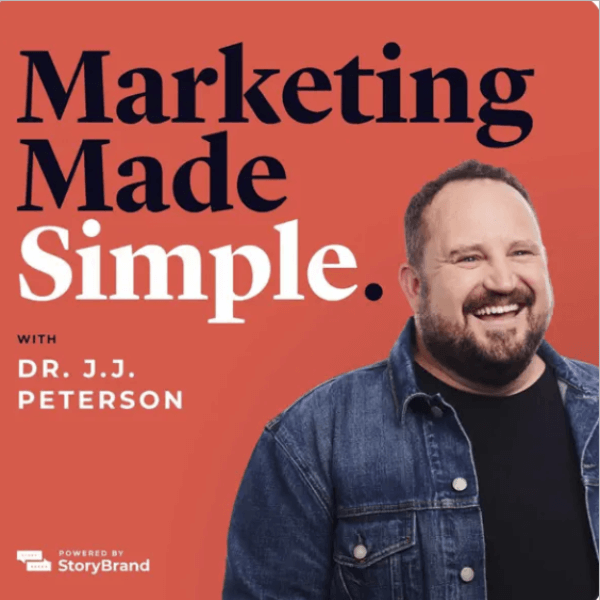Dr. J.J. Peterson smiling in a denim jacket on a coral background. The text reads “Marketing Made Simple with Dr. J.J. Peterson” in bold navy and white letters.