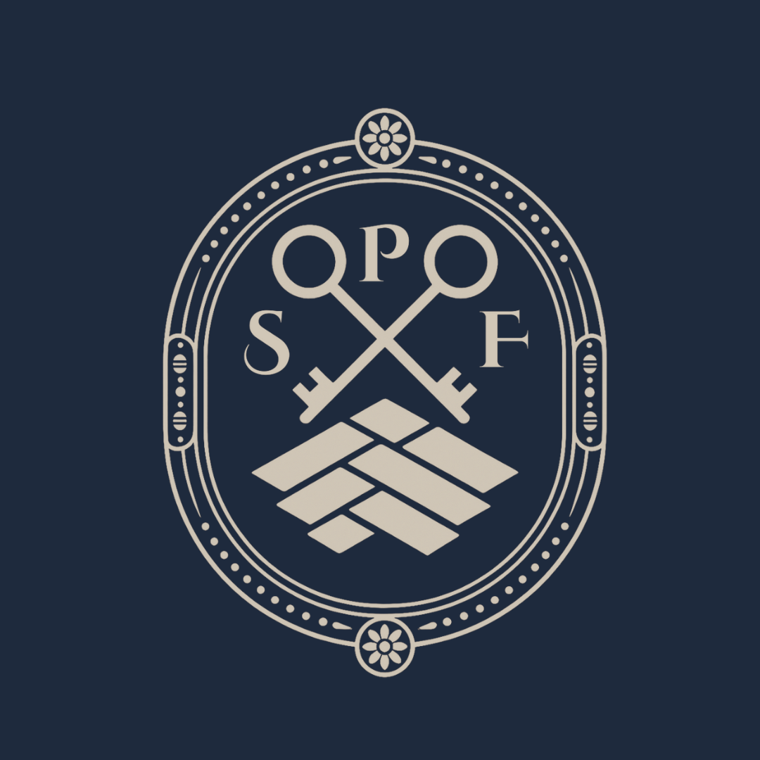 A logo with two crossed keys above a pyramid made of stacked blocks, all enclosed in an oval with decorative flowers at top and bottom, on a dark blue background.