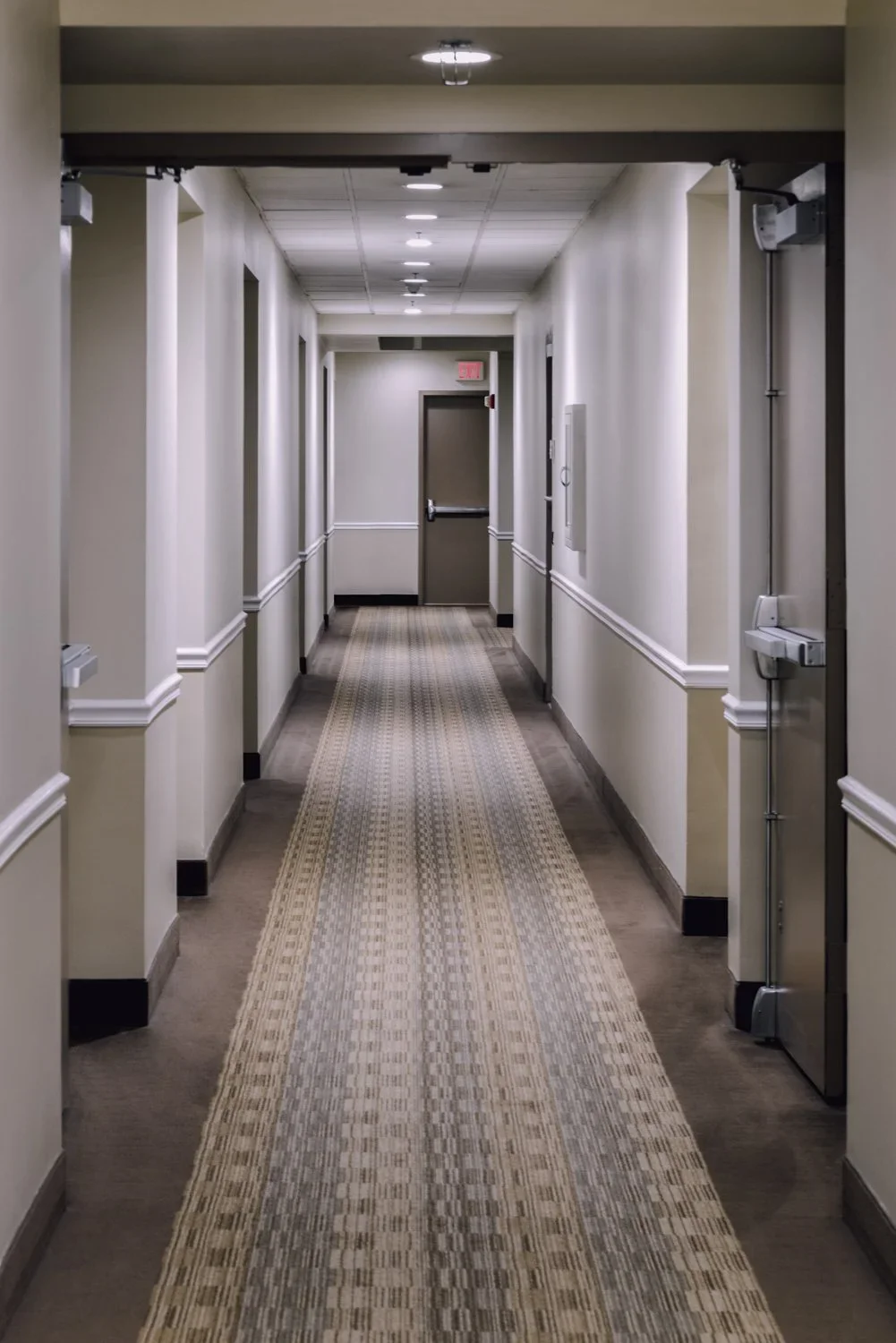Hotel and condo common area lighting renovation, illuminated by ceiling lights.