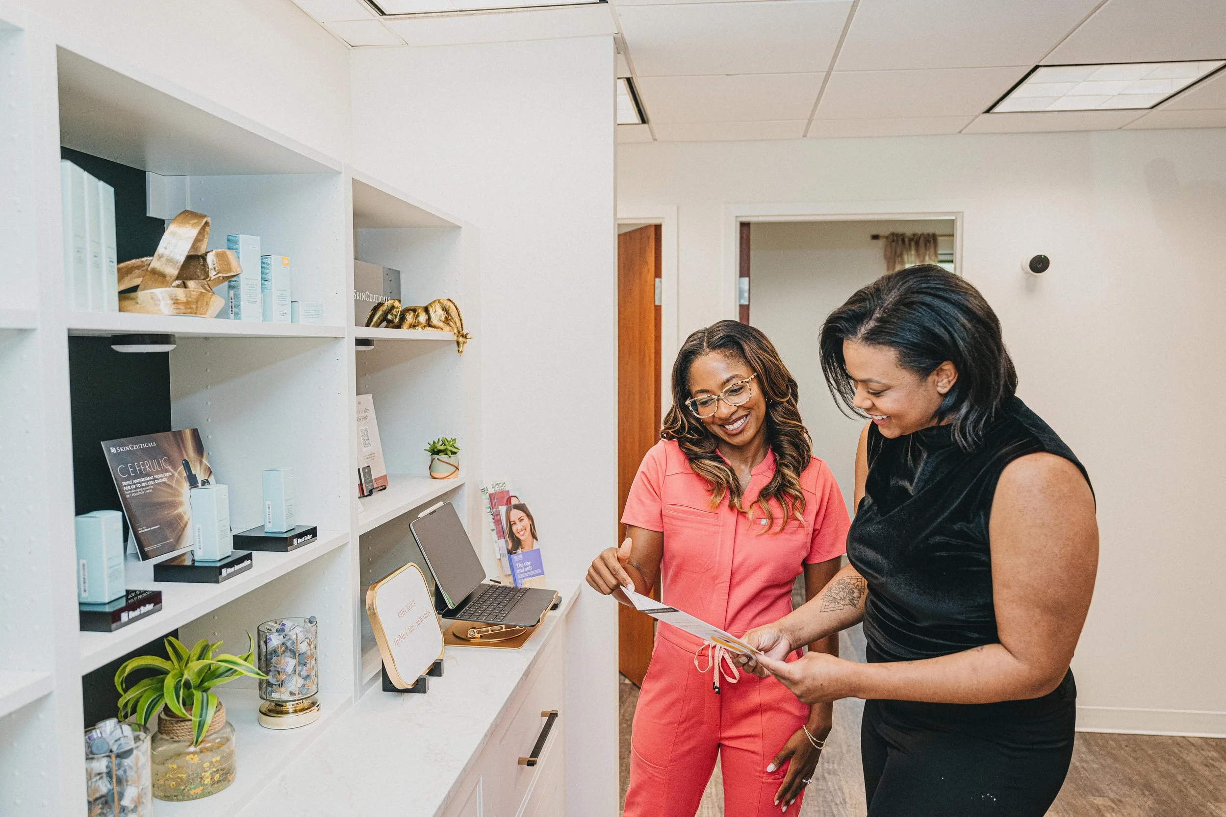 Provider discussing a personalized aesthetic treatment plan with a client