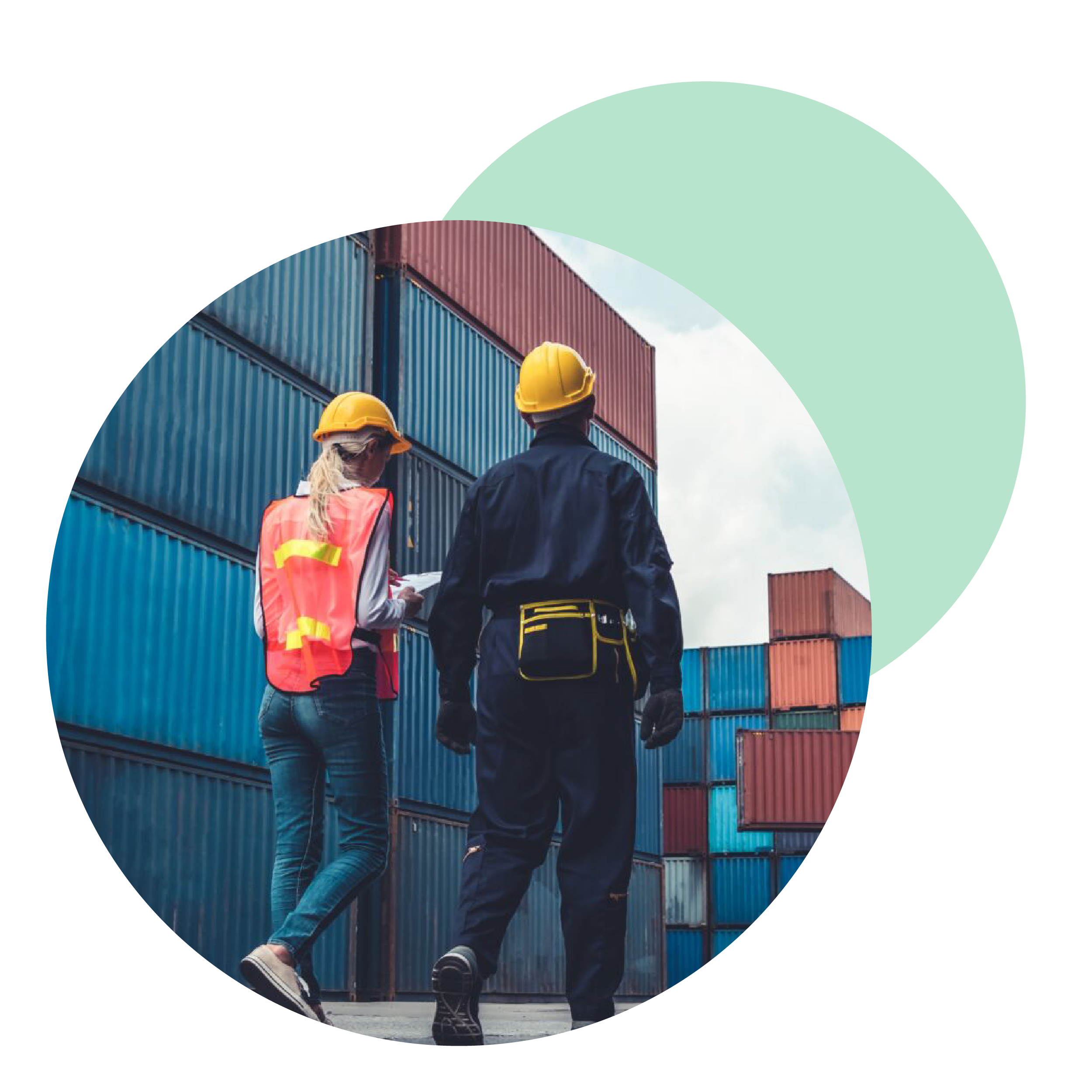 Two workers wearing safety helmets and vests inspecting shipping containers at a port.