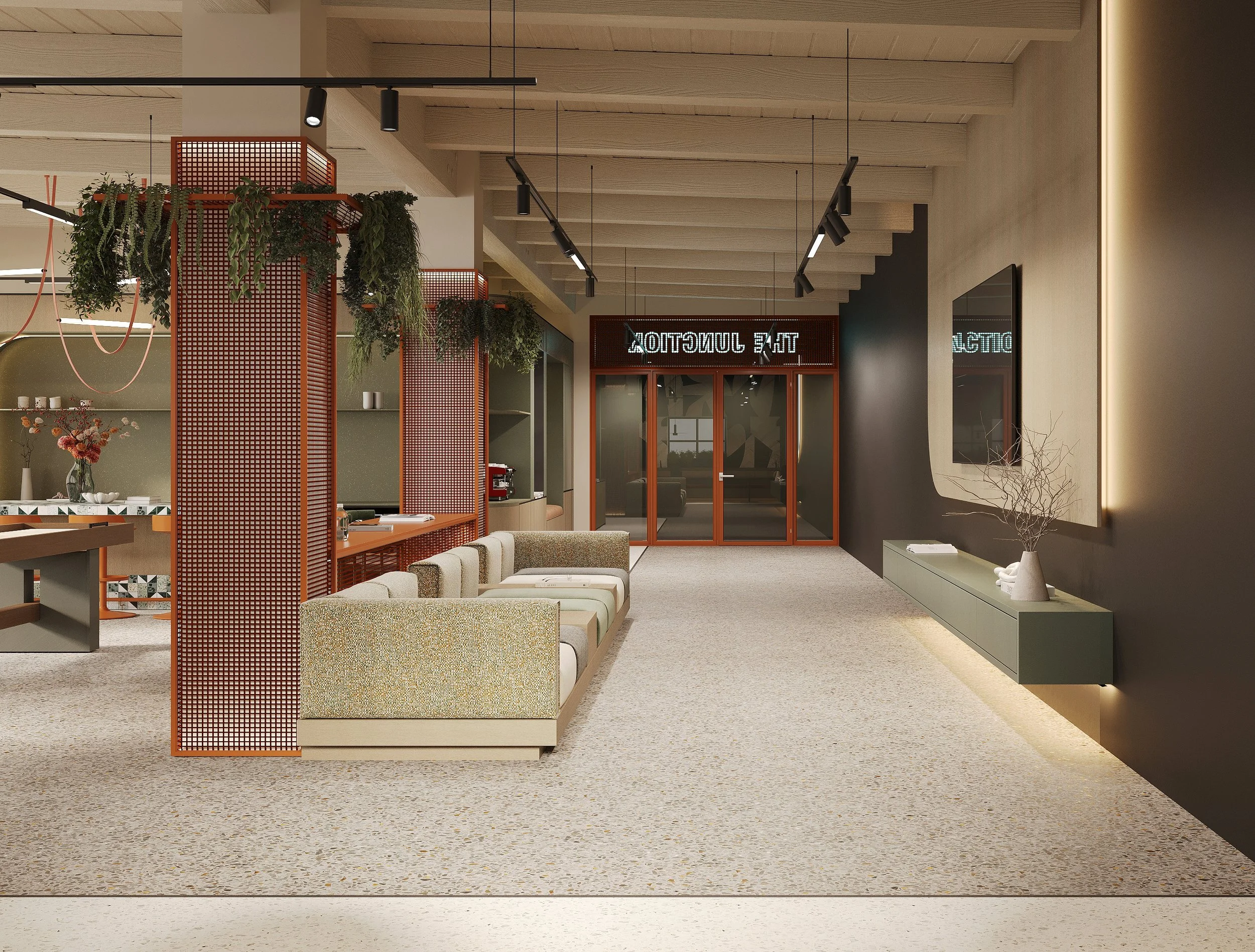Modern interior lobby with beige seating, black wall, textured flooring, and decorative greenery.