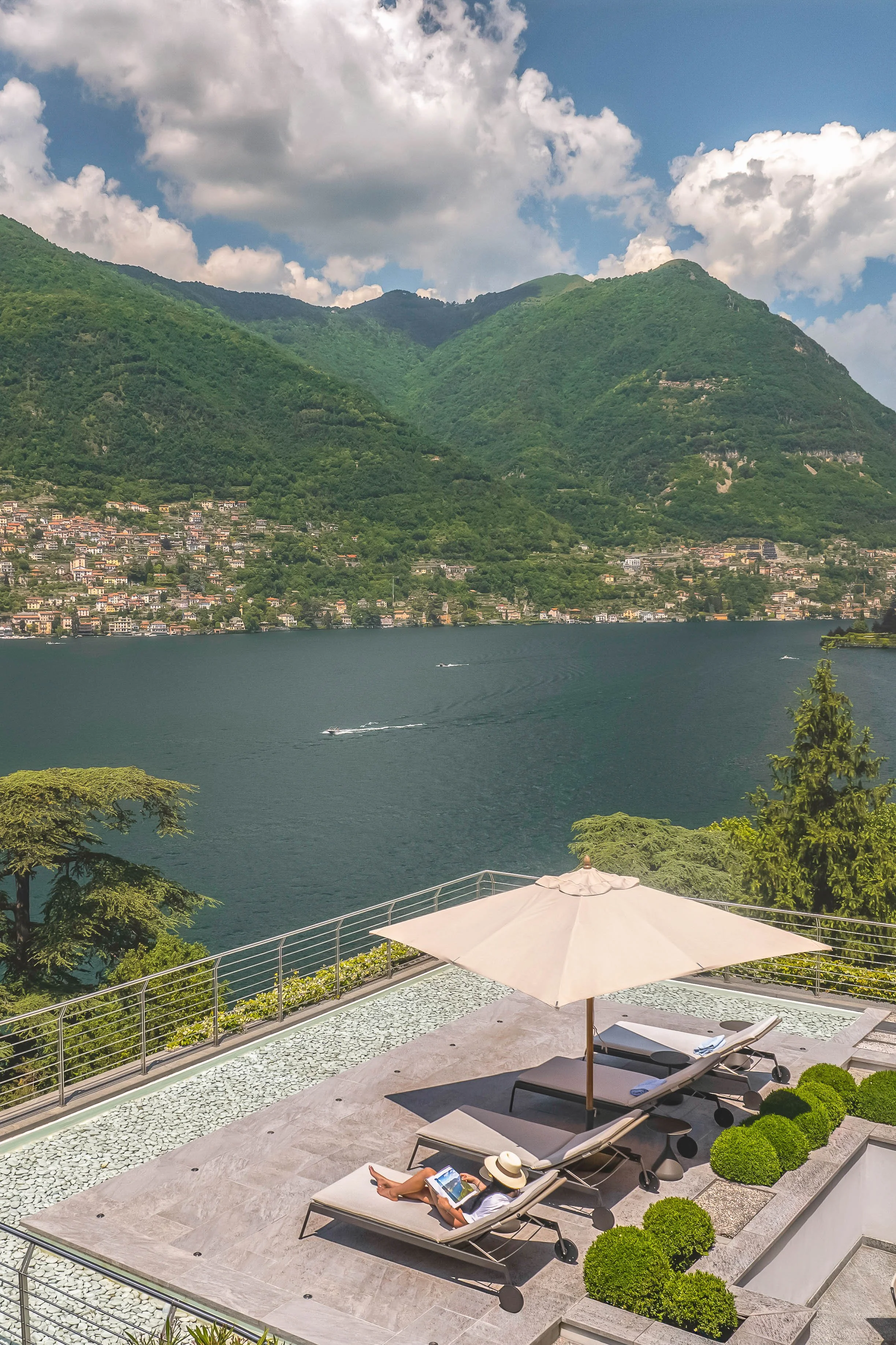 Luxury hotel branding and visual production, resort, modella su terrazza, sul lago di Como, fotografata con drone