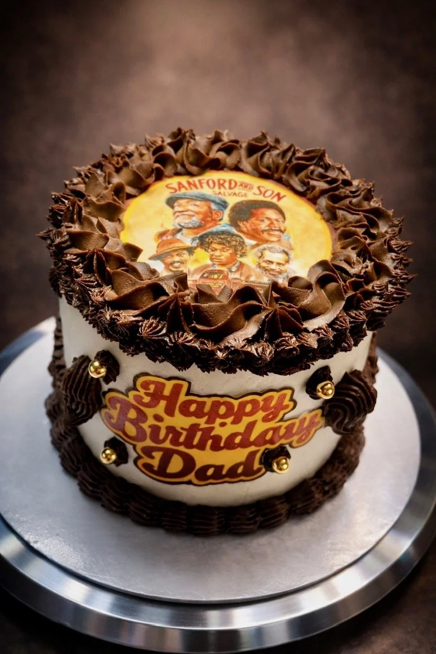 Chocolate Fudge 6in Round Cake w/ Black Cherry Ganache & Chocolate Ganache Filling. Vanilla Butter Cream w/ Chocolate Ganache Piping/ Edible Image.