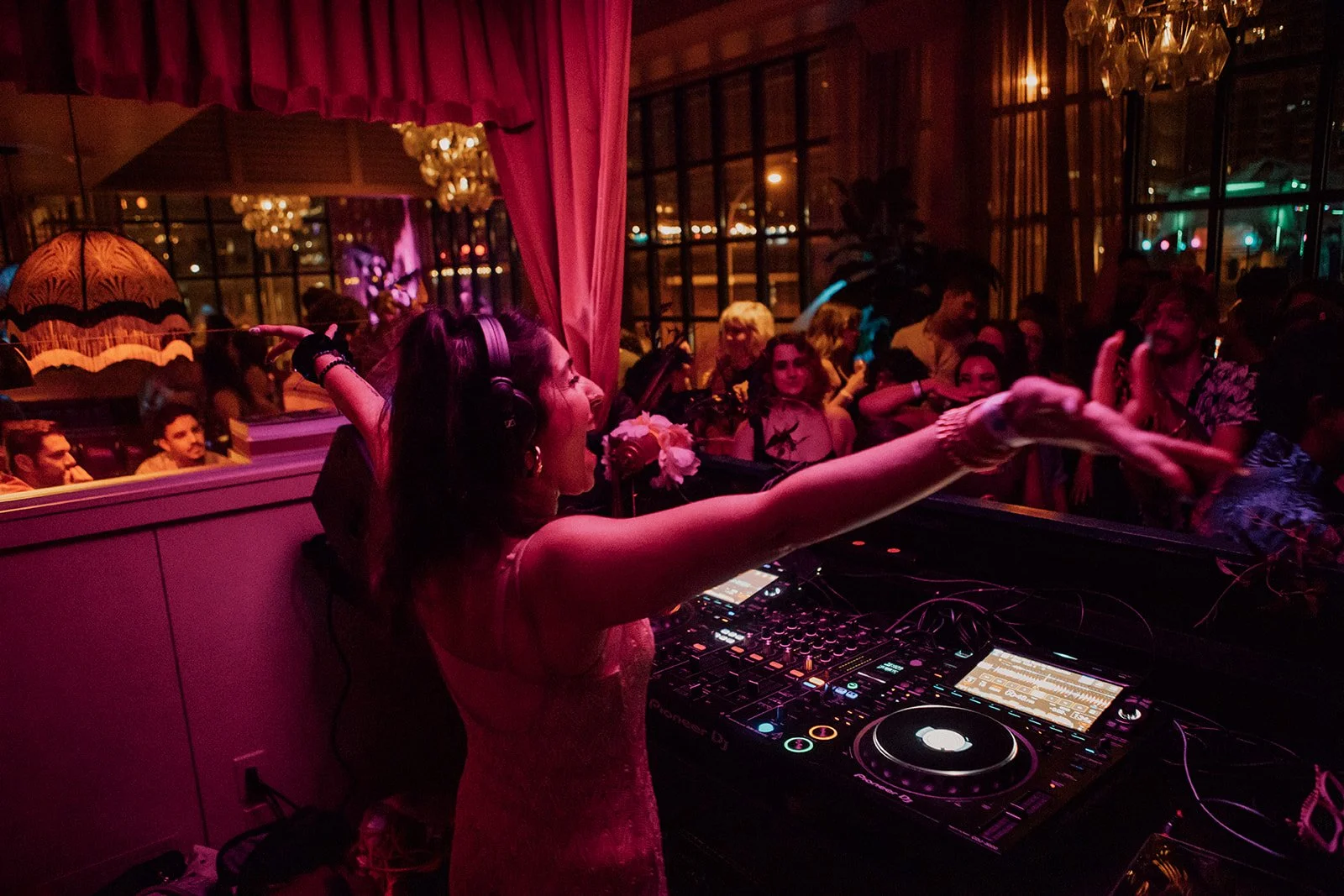 Energetic DJ performing at club in Austin, TX.