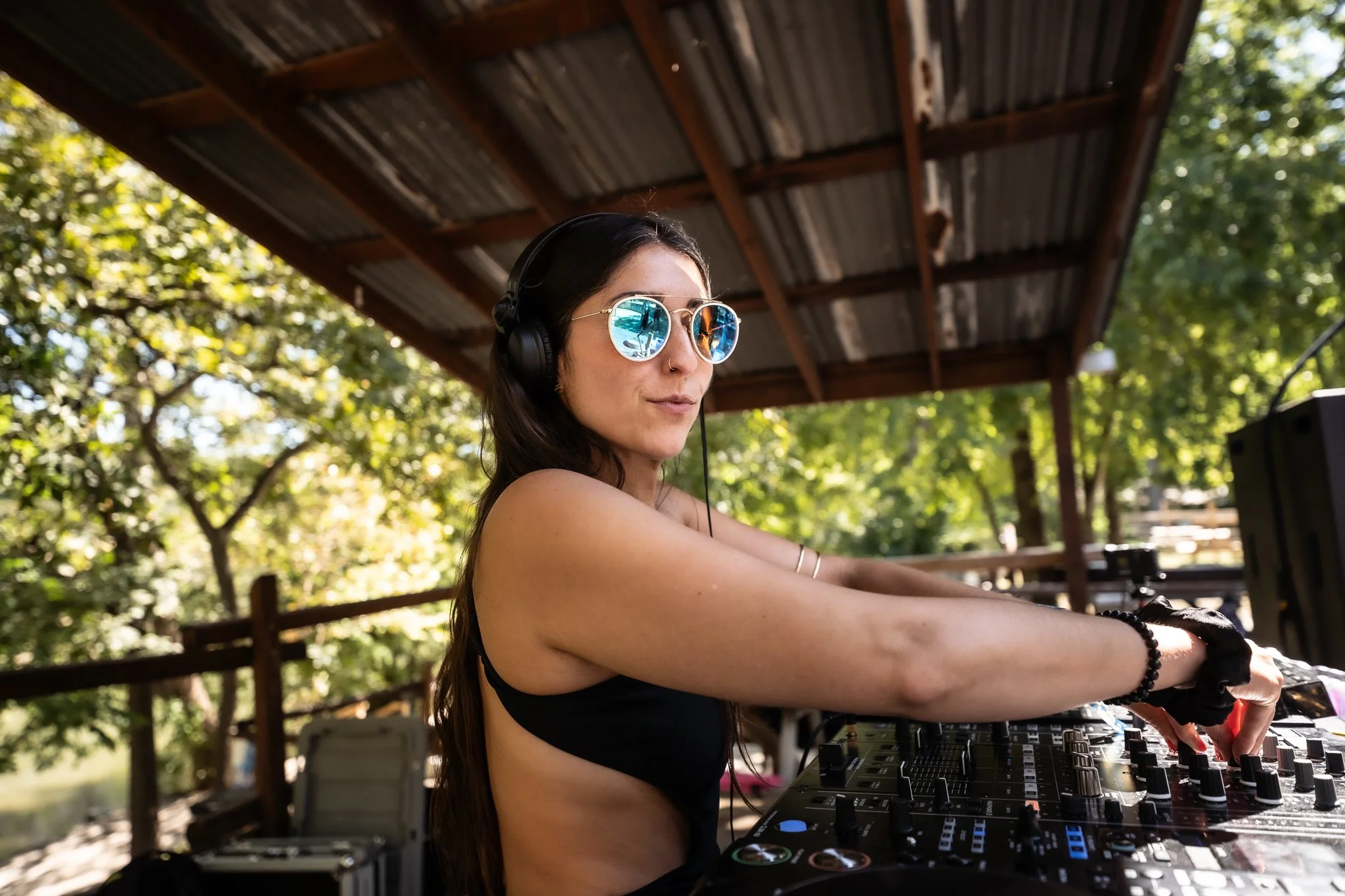 DJ and vocalist performing at Art, Music & Camping Festival.