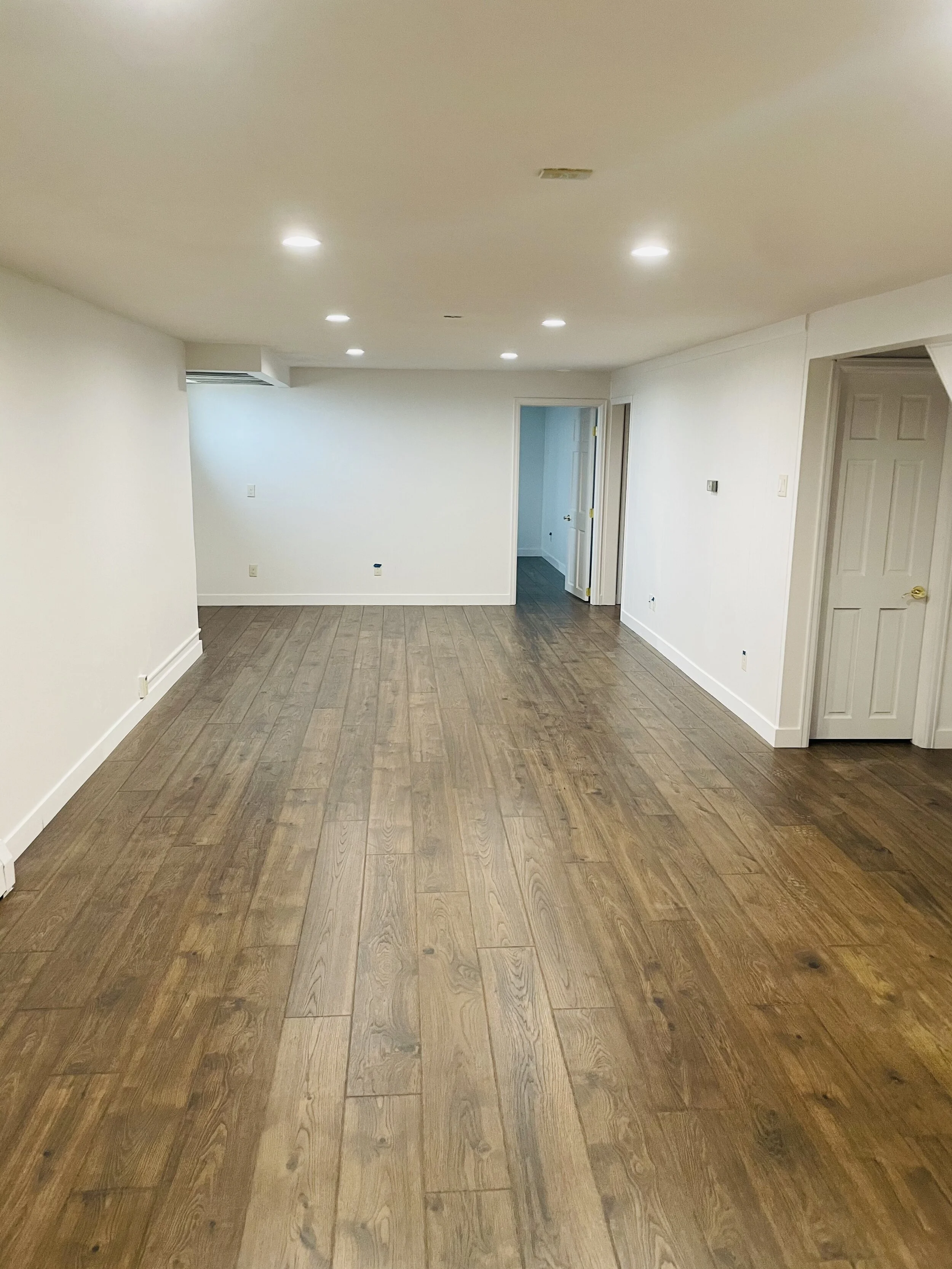 AFTER - Basement Remodel.

 We installed new flooring, updated trim, doors, pot lights and fresh paint.