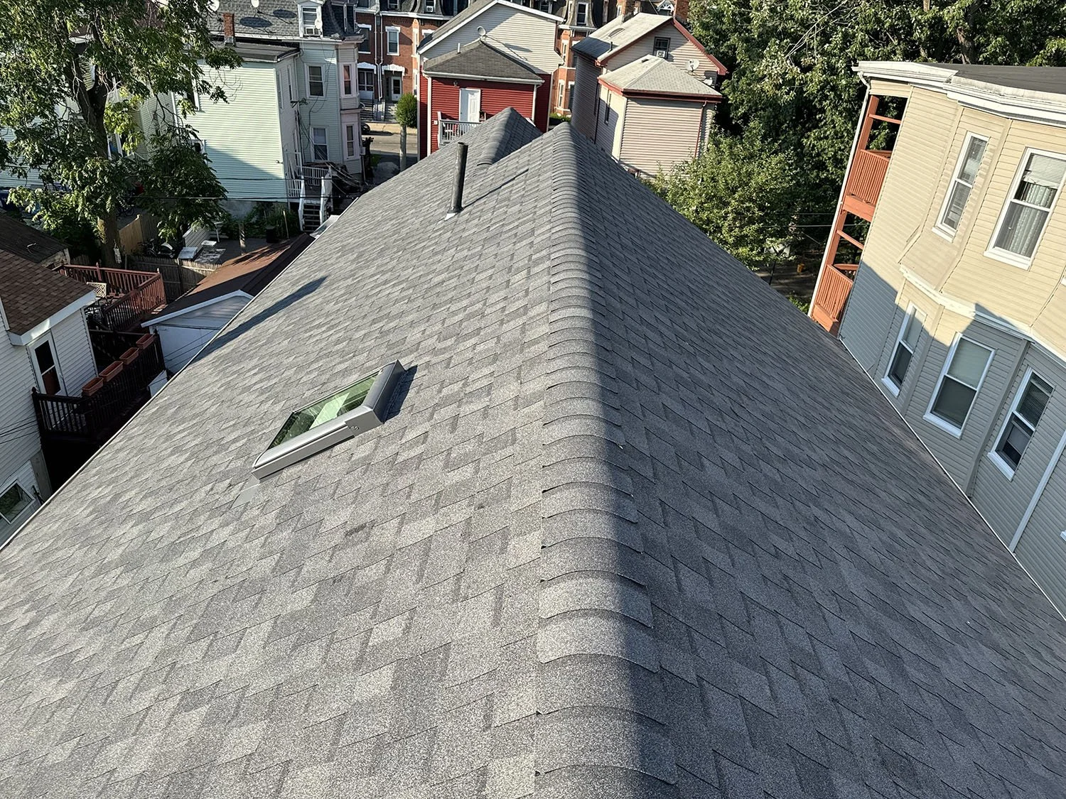 Before-and-after comparison of a completed roof project
