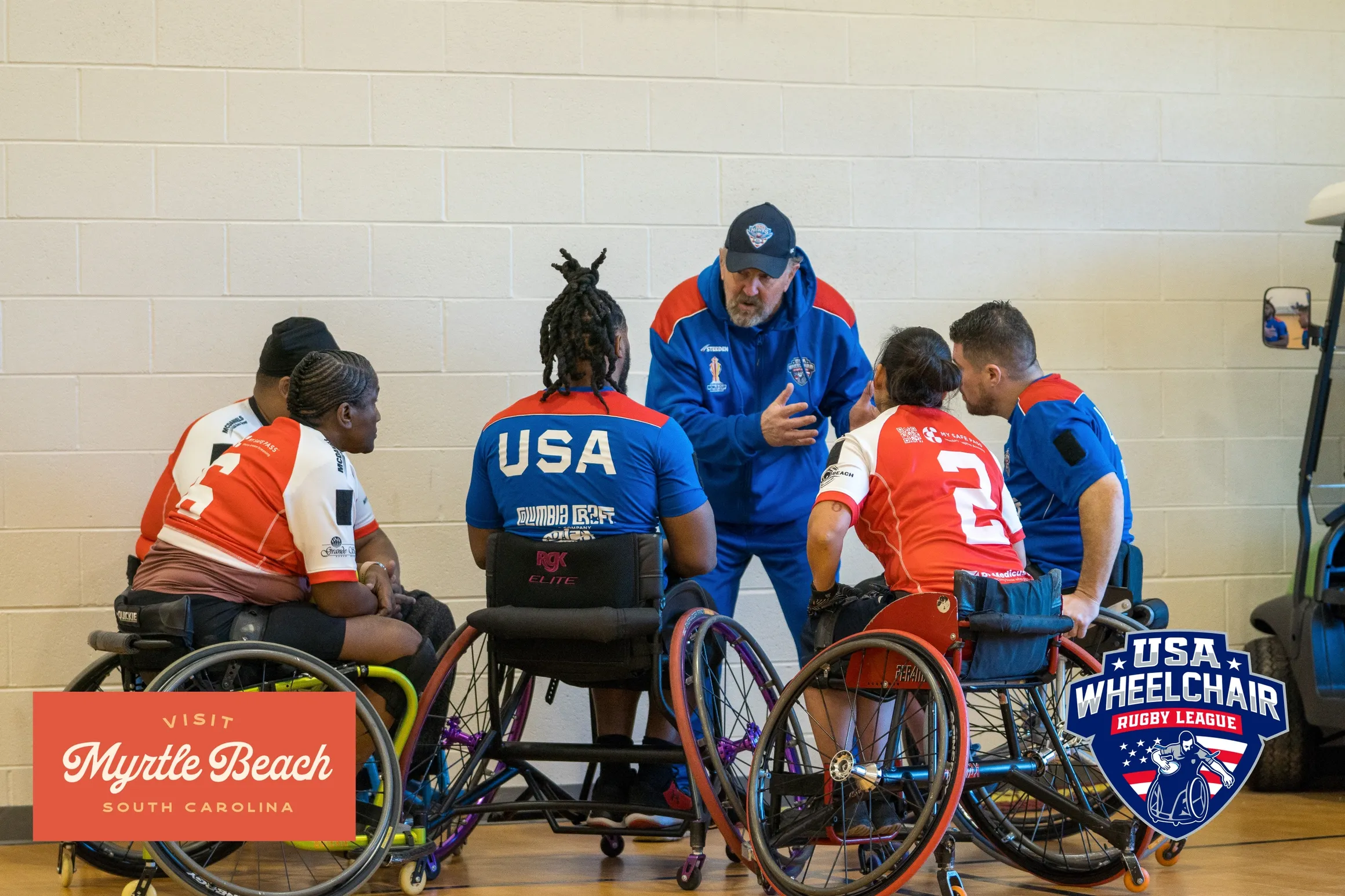 Wheelchair rugby players in action during a game, with a large logo and text for the 2025 World Wheelchair Rugby Championship in the background.