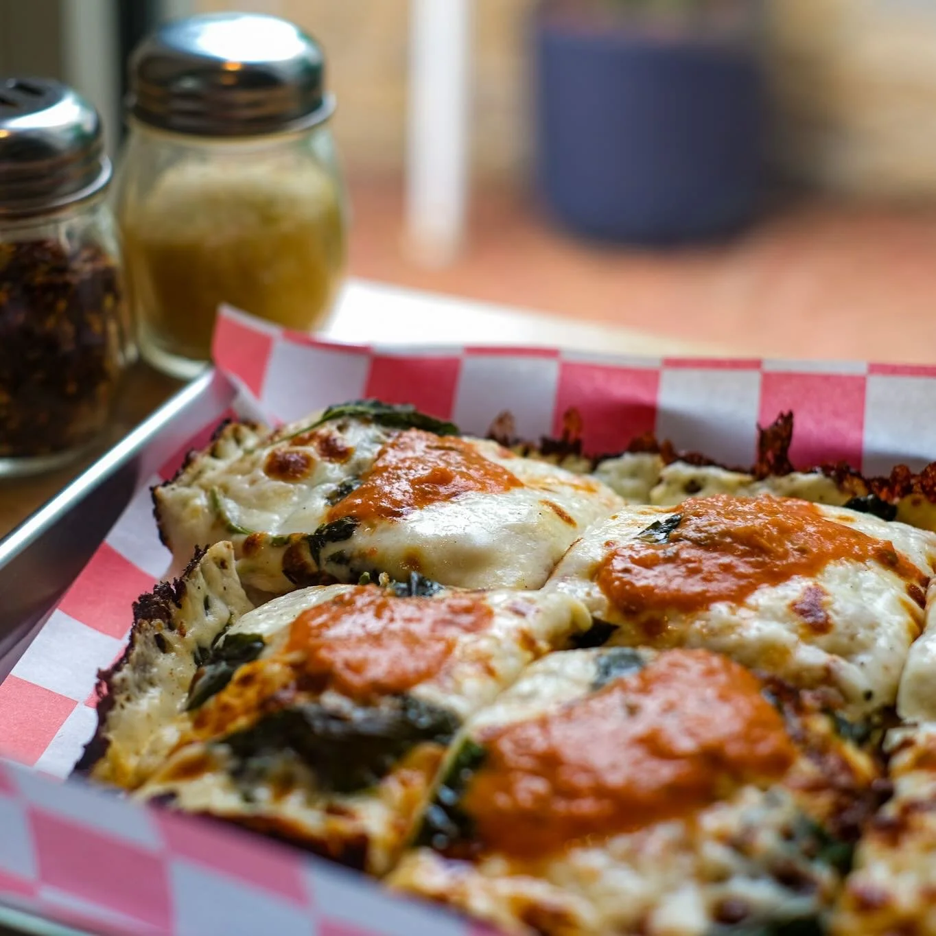 Is your mouth watering too? Vodka Margarita. House made vodka sauce, basil, roasted garlic, fresh mozzarella &amp; pecorino all on our crispy Detroit crust.