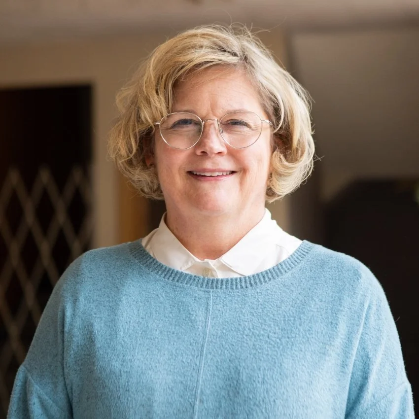 Jericho Road Ministries' Volunteer Coordinator, Amanda Knoke, smiling indoors