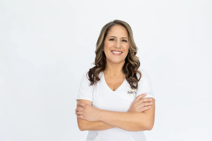 Monica Skalsky, founder of Wrthit and The Wrthit Way wearing a white scrub top