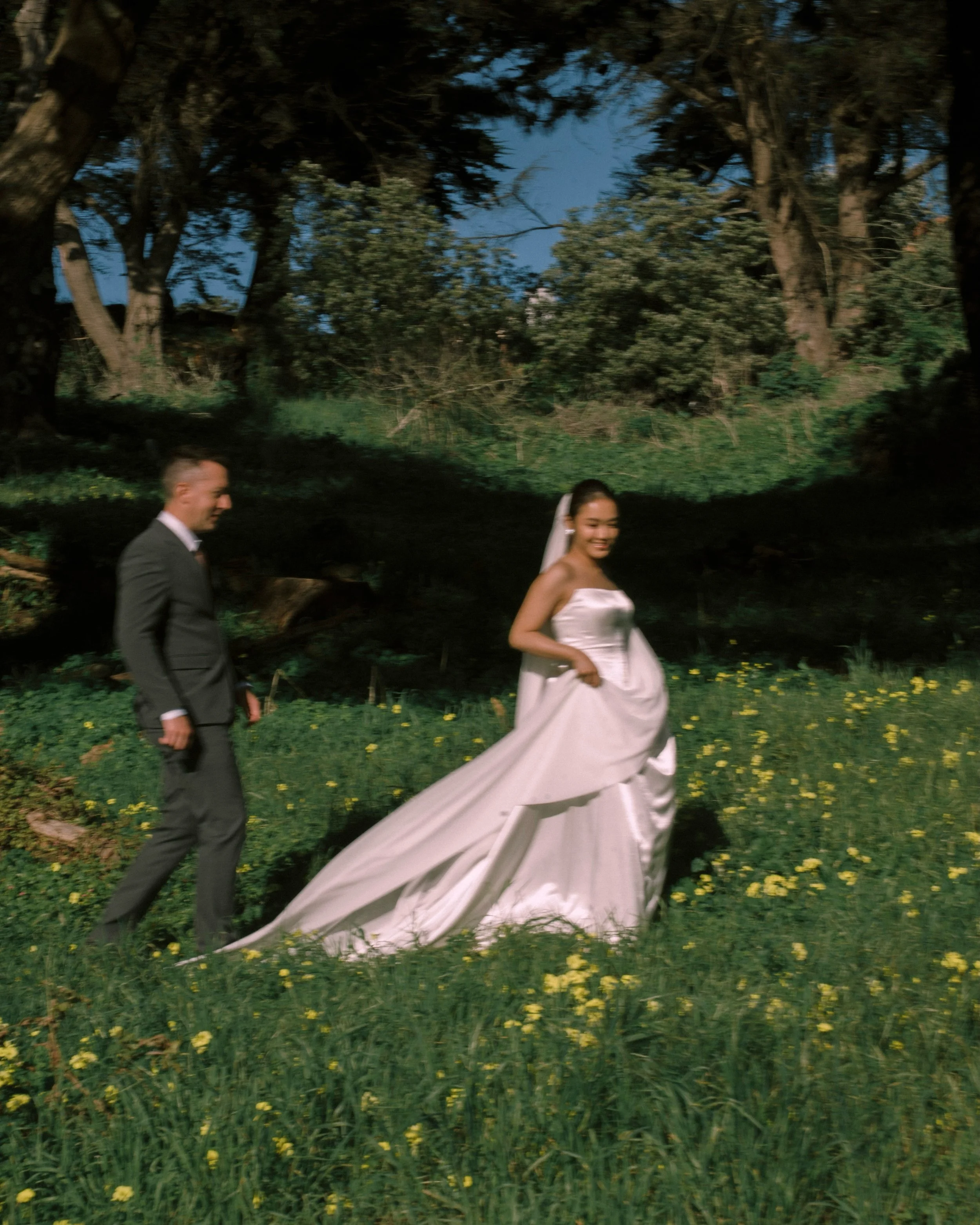 Stepping over the dirt tracks and into the flowers🌼

 🩵E &amp; J at the edge of the city.

photo | @anotherday.wedding 
makeup | @emihevision 
bridal &amp; veil | @whisper_veil_studio
