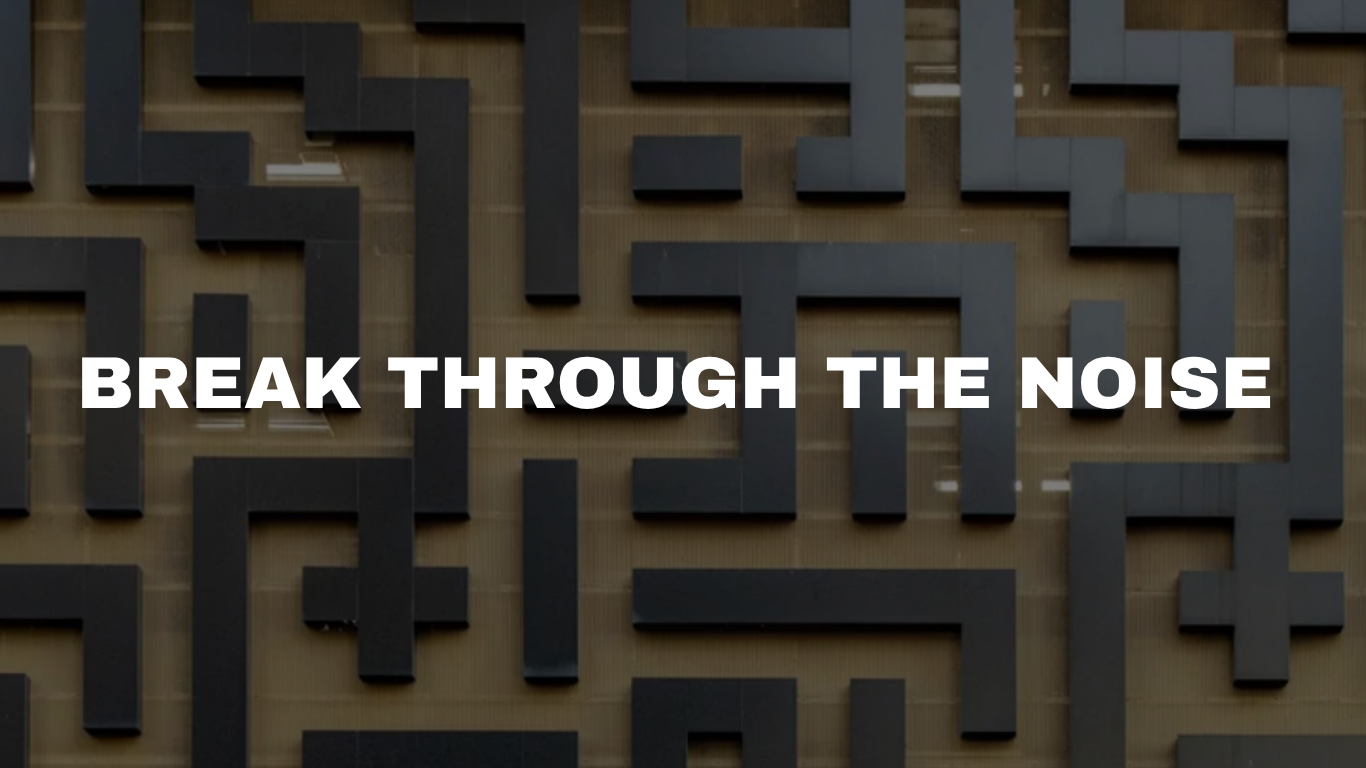 A wall with a maze design and the words "Break Through the Noise" written across the center in bold white letters.