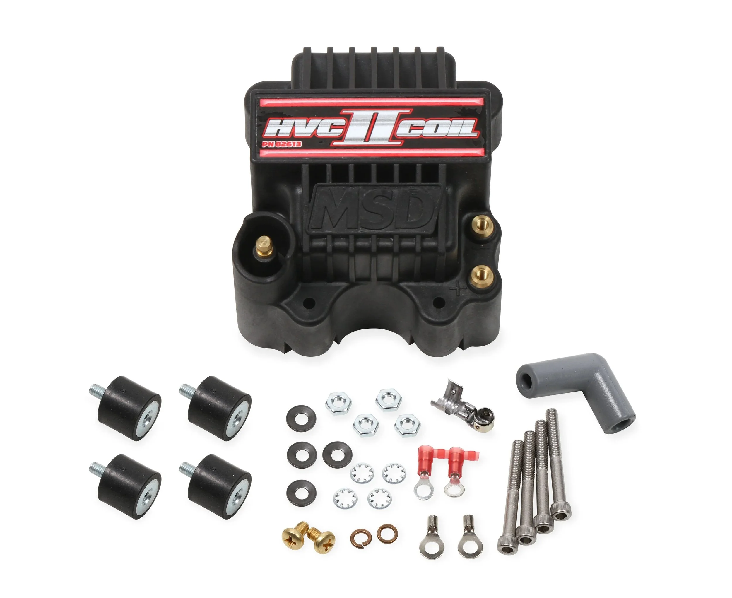 MSD HVC-2 series ignition coil. Black in color. Has gold color posts. Says MSD in black. Says HVC II Coil in red and silver on the top. Next to all the hardware and terminals that are included.