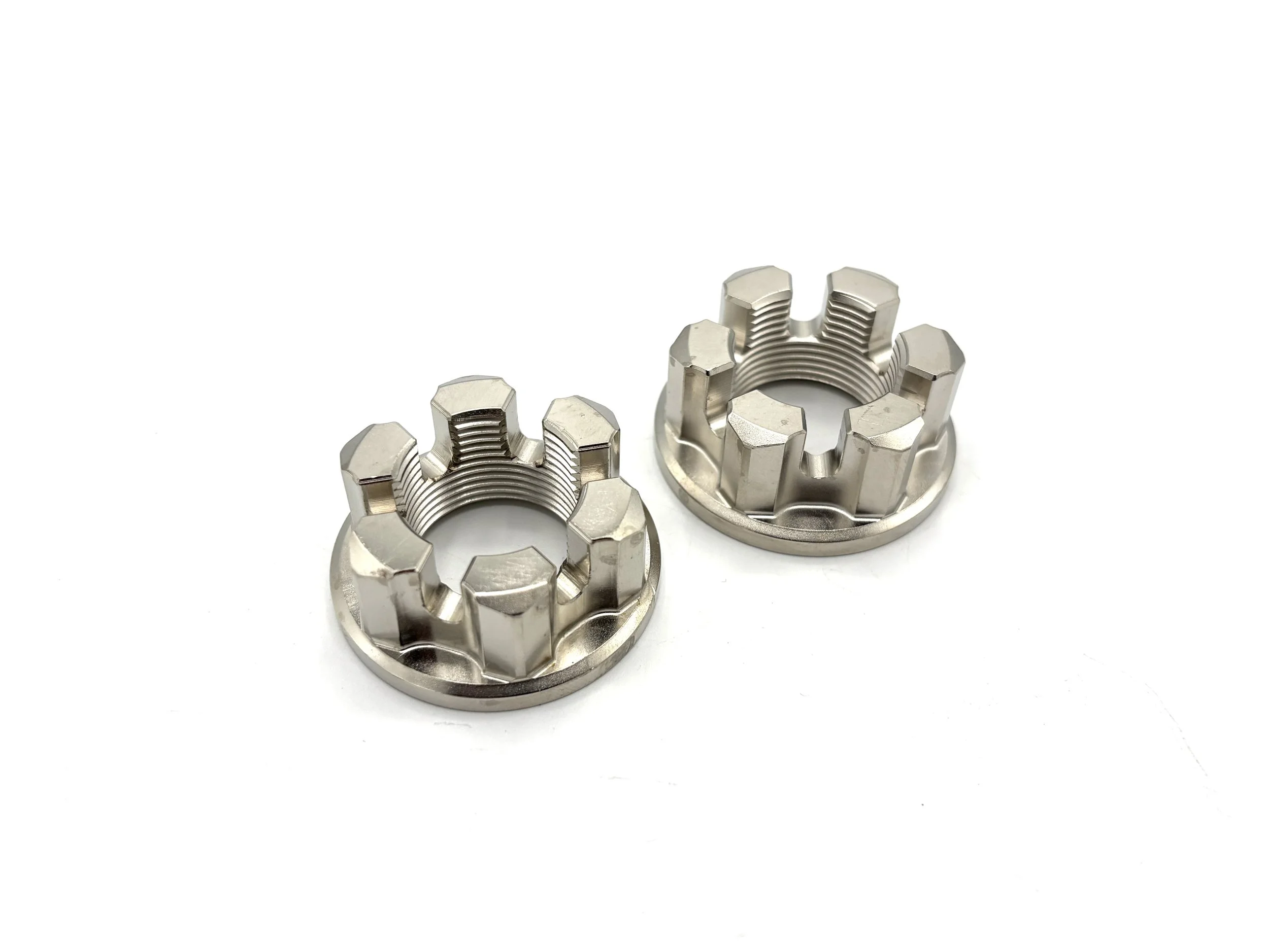 Two silver color axel nuts.