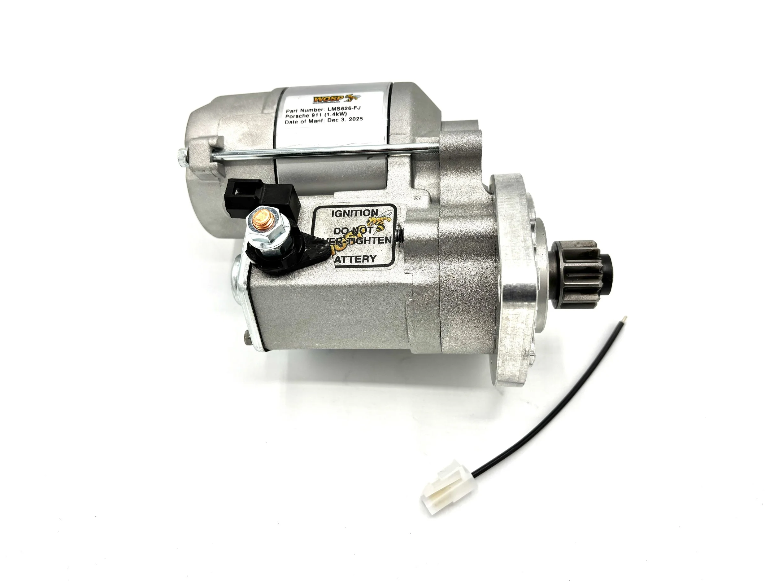 WOSP High Torque Gear Reduction VW Starter. Gray in color. Has small gear on the front. Has wire post on the side and a single pin plug. Has motor on top. With wire.