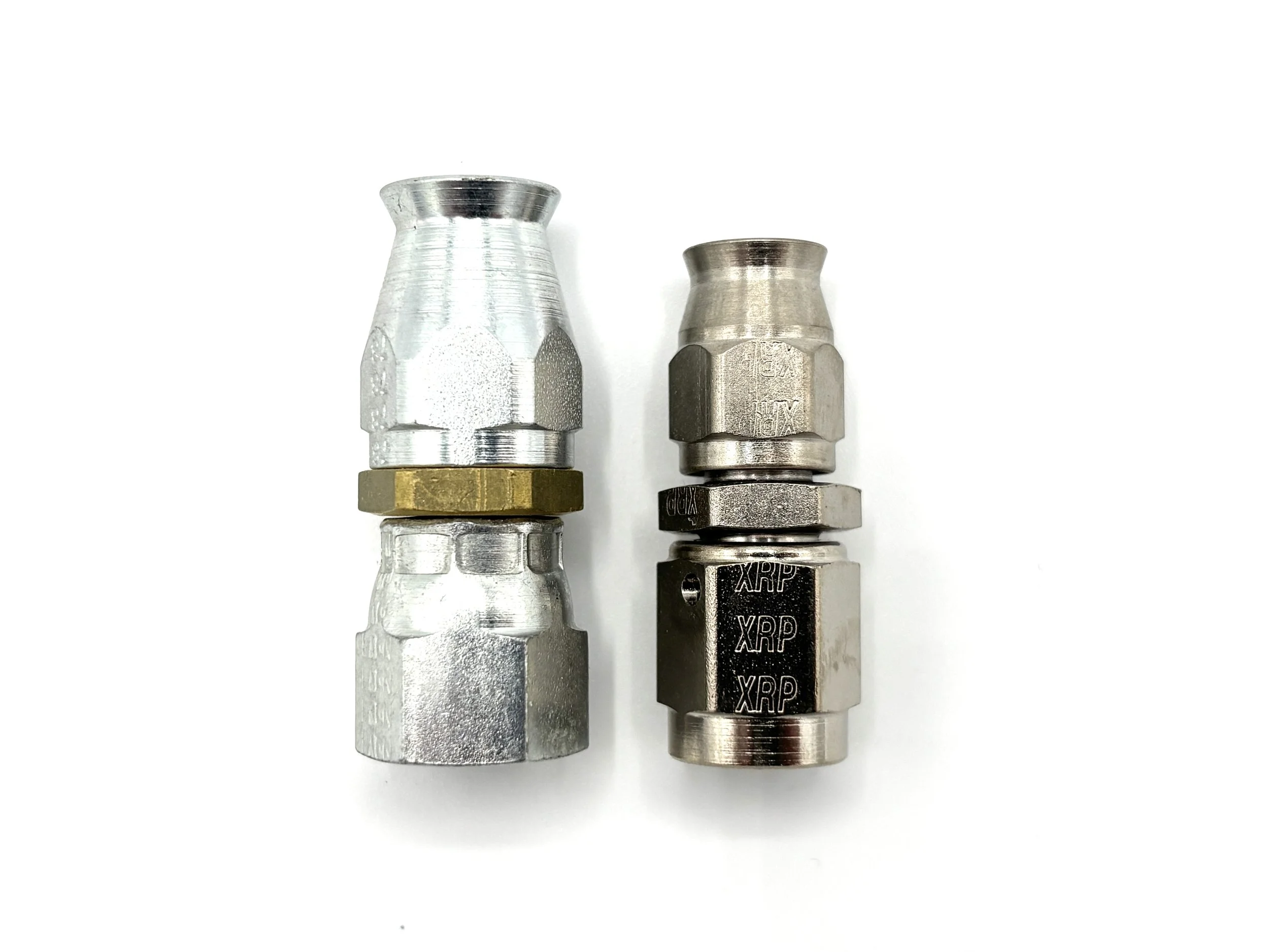 Two metallic connectors side by side on a white background, the left connector is silver with a gold top, and the right connector is black marked with 'XRP'.