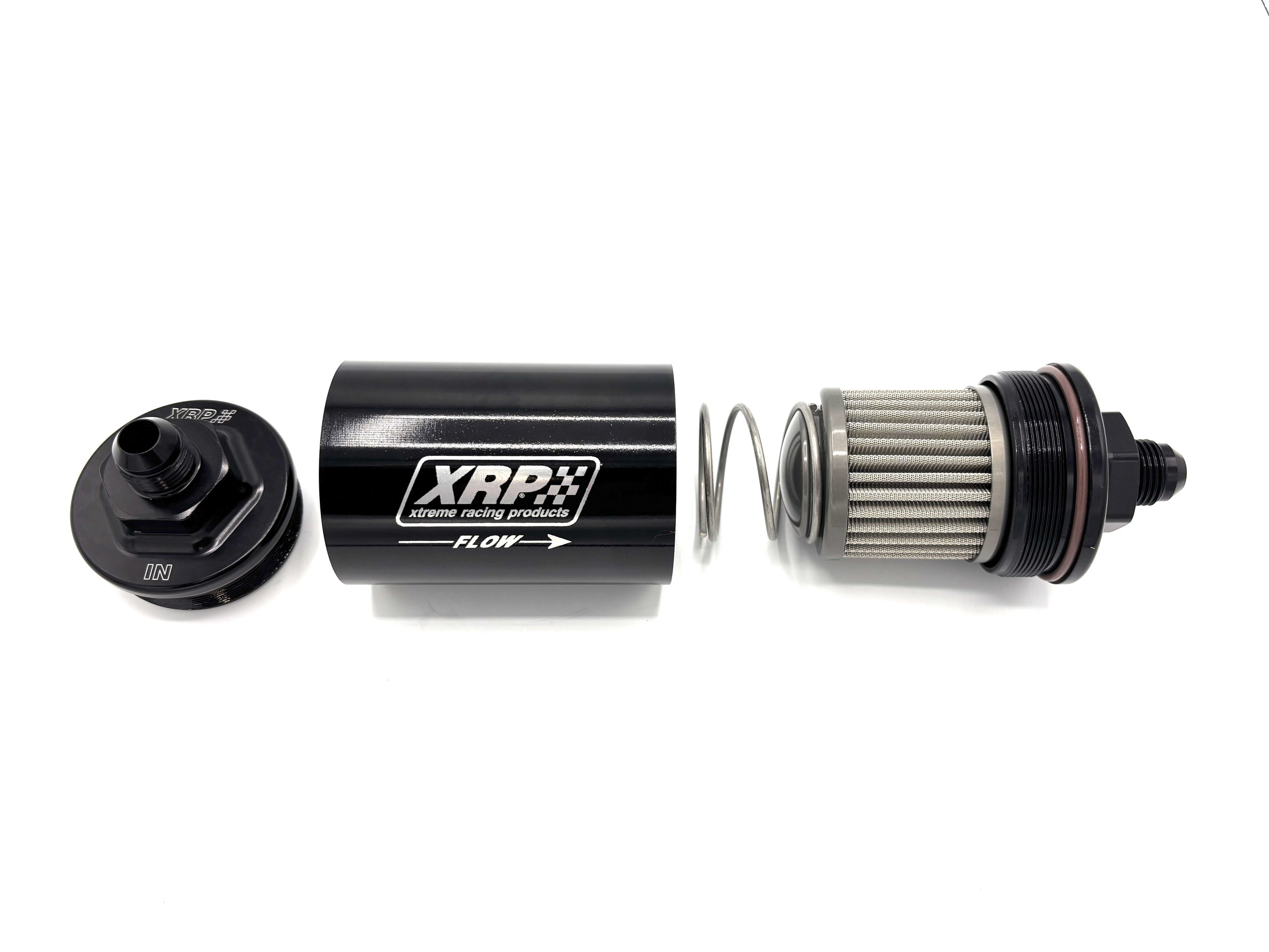 XRP 71 series short body in-line filter with AN male inlet and outlet. Black in color, says XRP on the side and shows the flow direction. Exploded view.