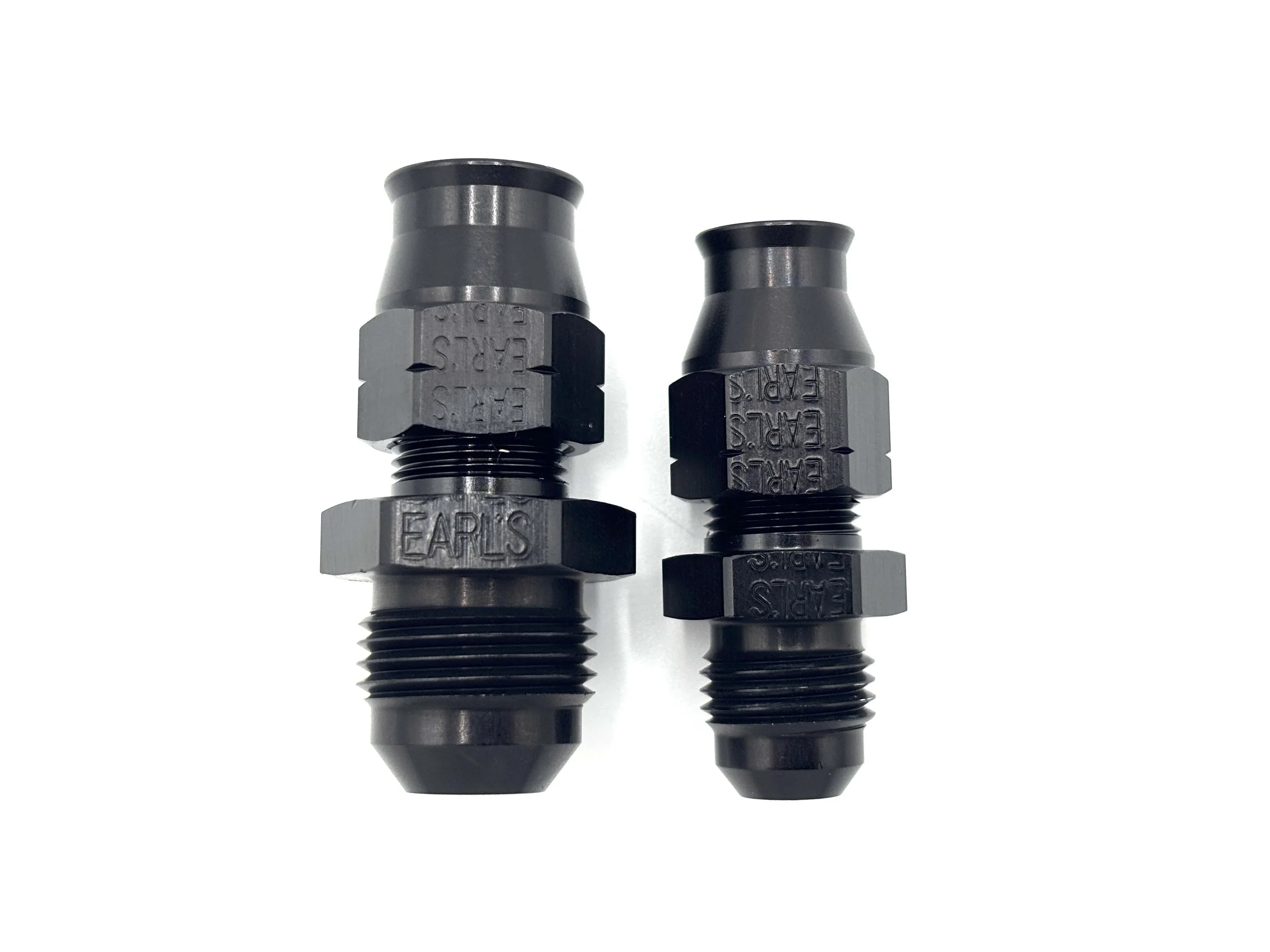 Earl’s AN male to tube compression adapter fitting. Black in color. Various sizes from largest to smallest, left to right.