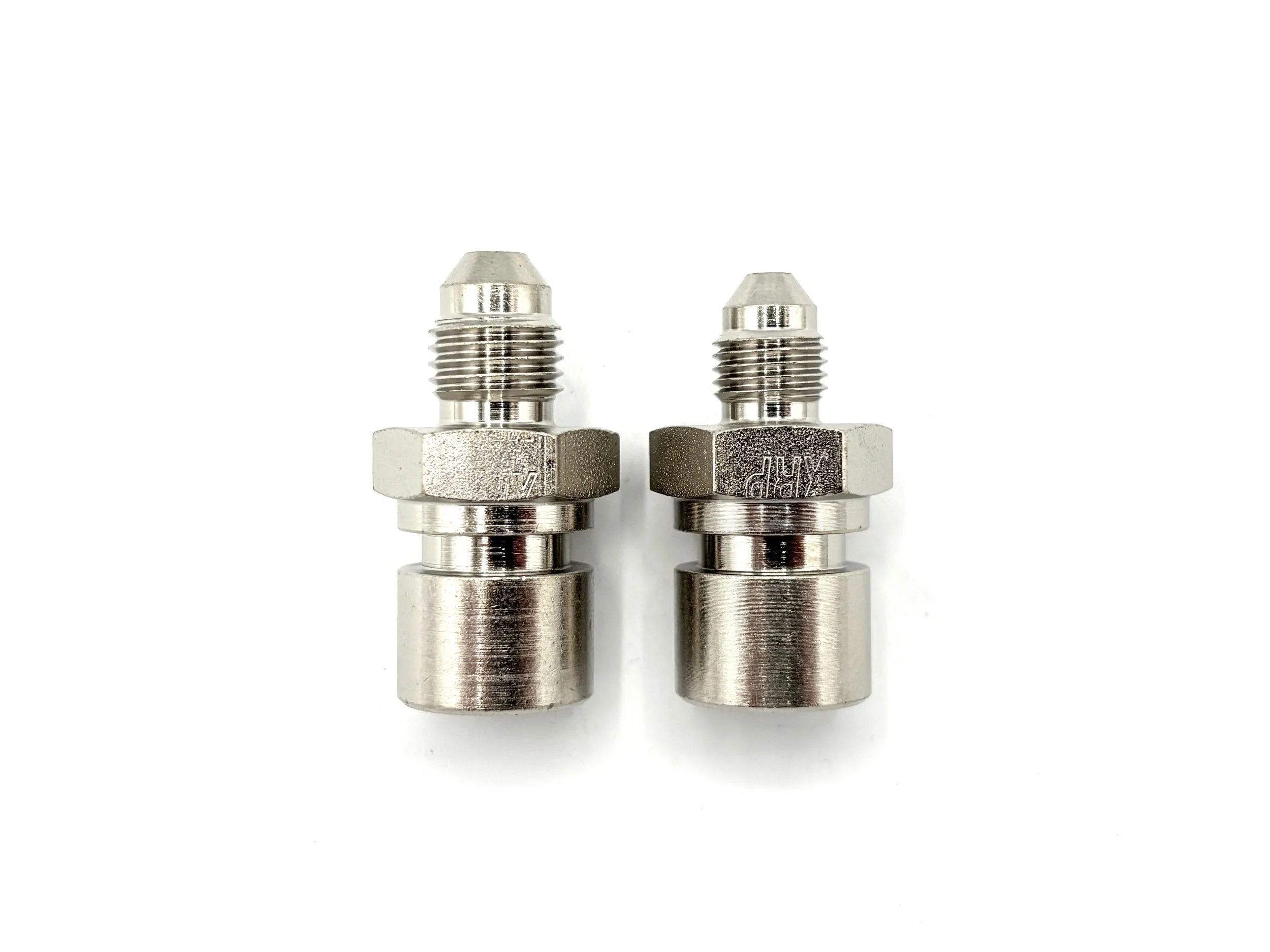 XRP AN male to 7/16-24 female steel inverted flare brake adapter. Silver in color. Various sizes from largest to smallest, left to right.