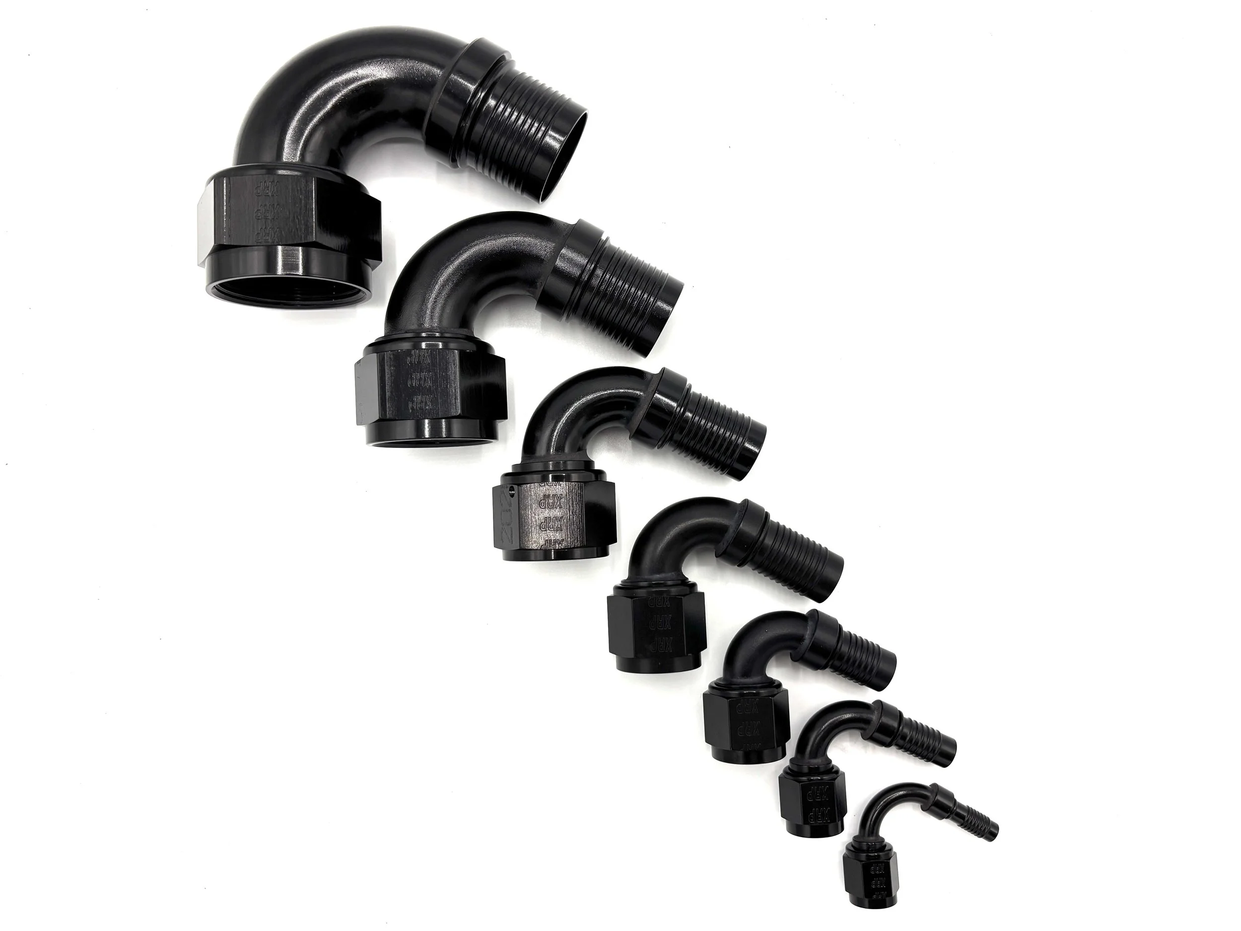 XRP 120 deg. HS-79 crimp hose end to AN female. Black in color. Various sizes from largest to smallest, left to right.
