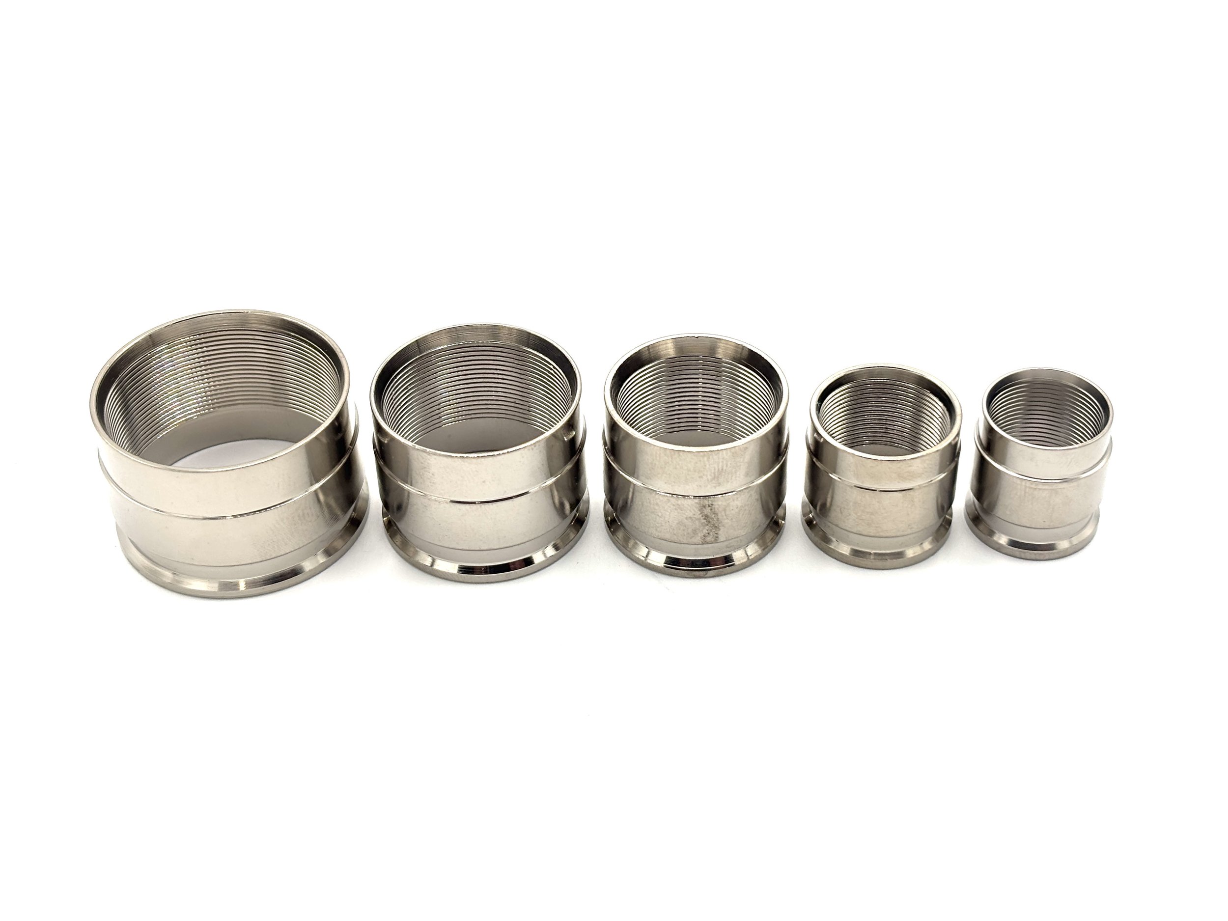 XRP ProPlus PTFE crimp collar. Silver in color. Various sizes from largest to smallest, left to right.