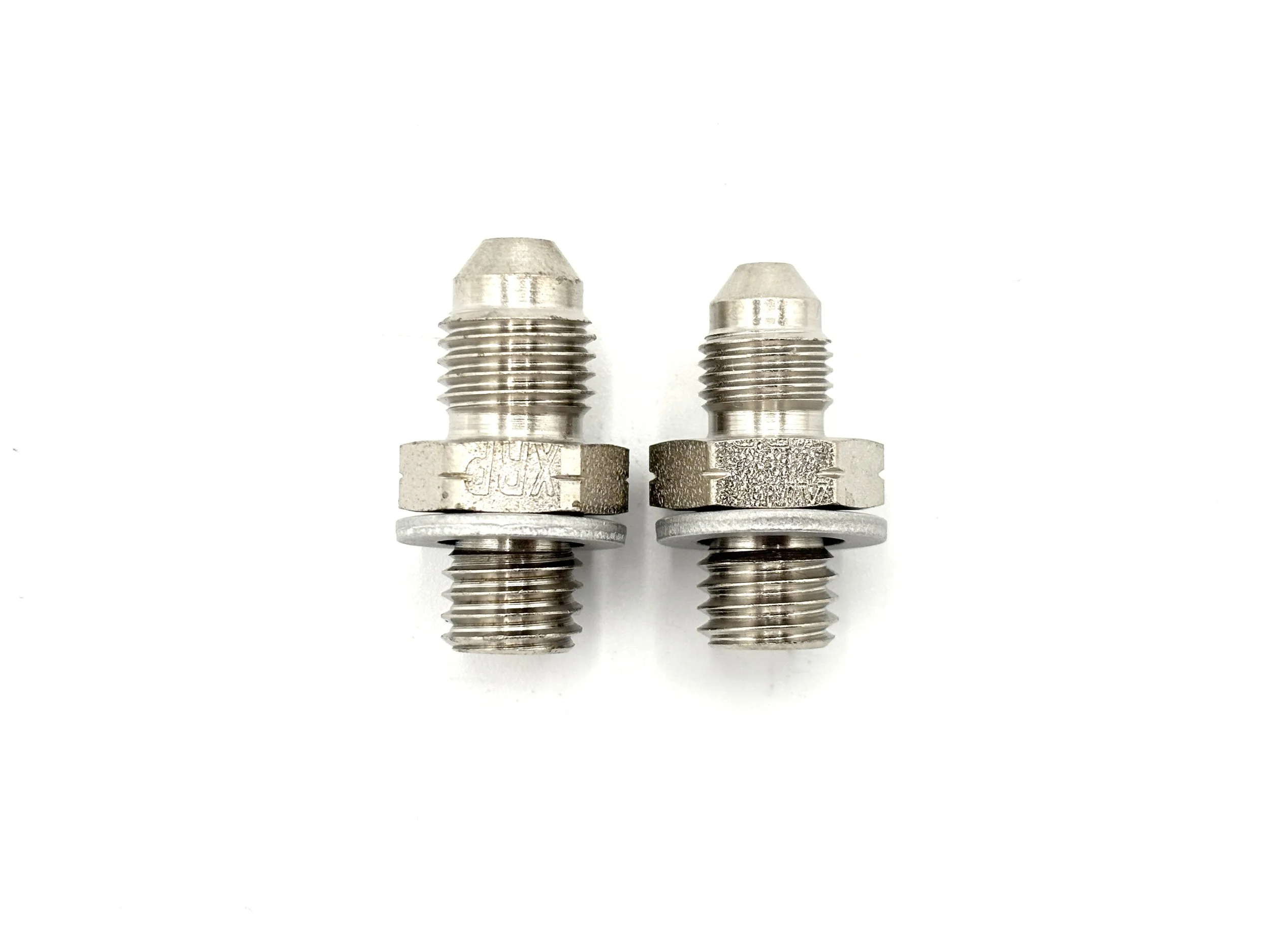 XRP AN male to M10 x 1.5 male steel crush washer seal adapter. Silver in color. Various sizes from largest to smallest, left to right.