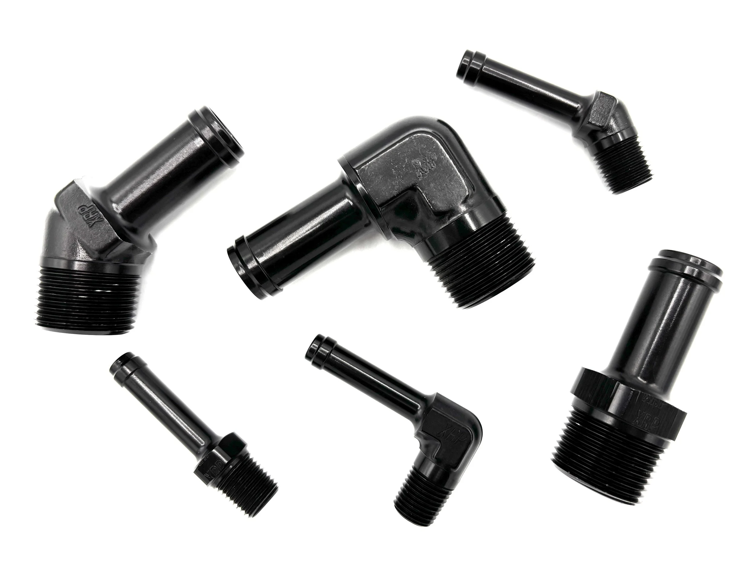 Various hose barb fittings on a white background.