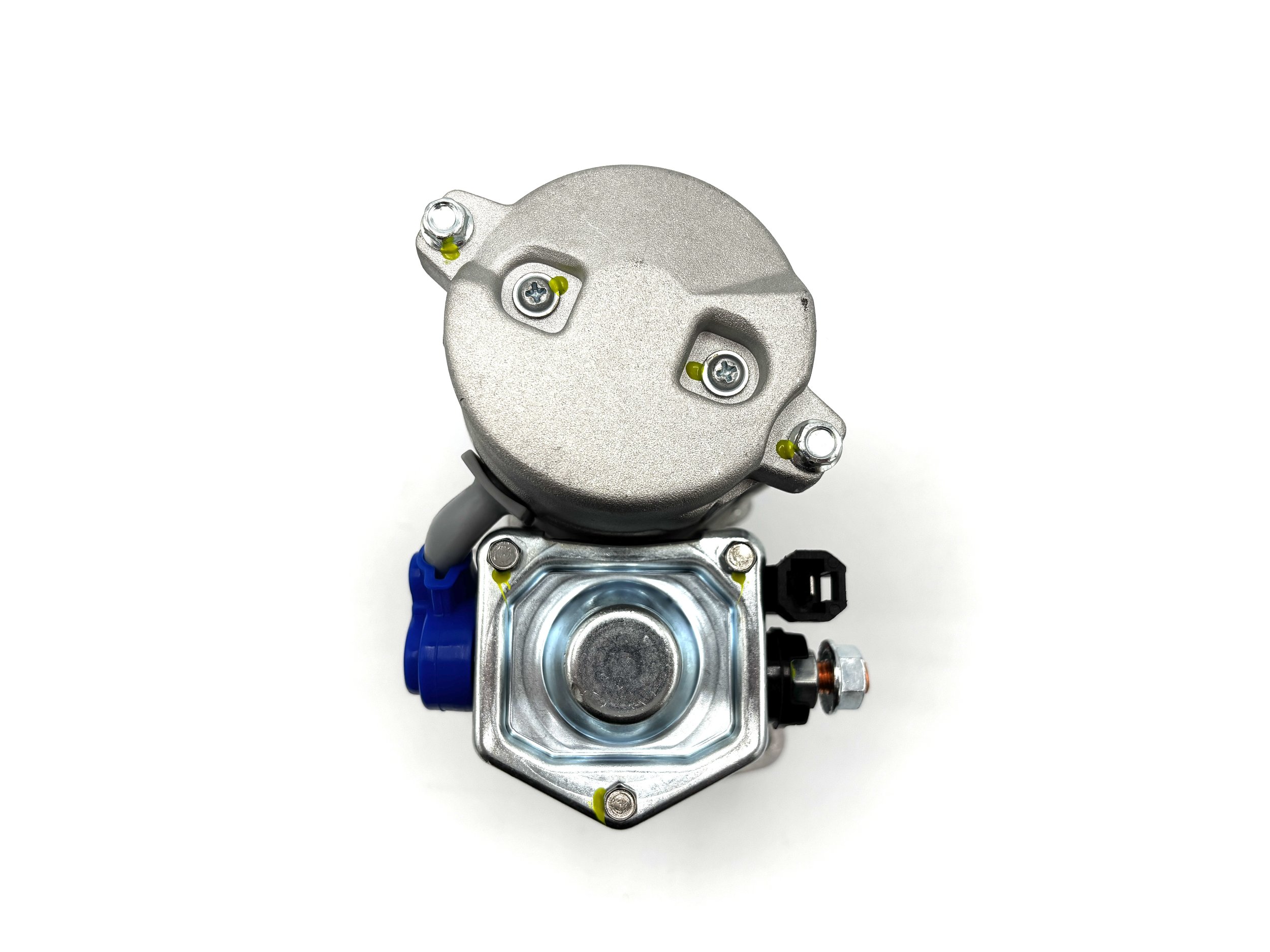 WOSP High Torque Gear Reduction VW Starter. Gray in color. Has small gear on the front. Has wire post on the side and a single pin plug. Has motor on top. Has Blue wire post boot.