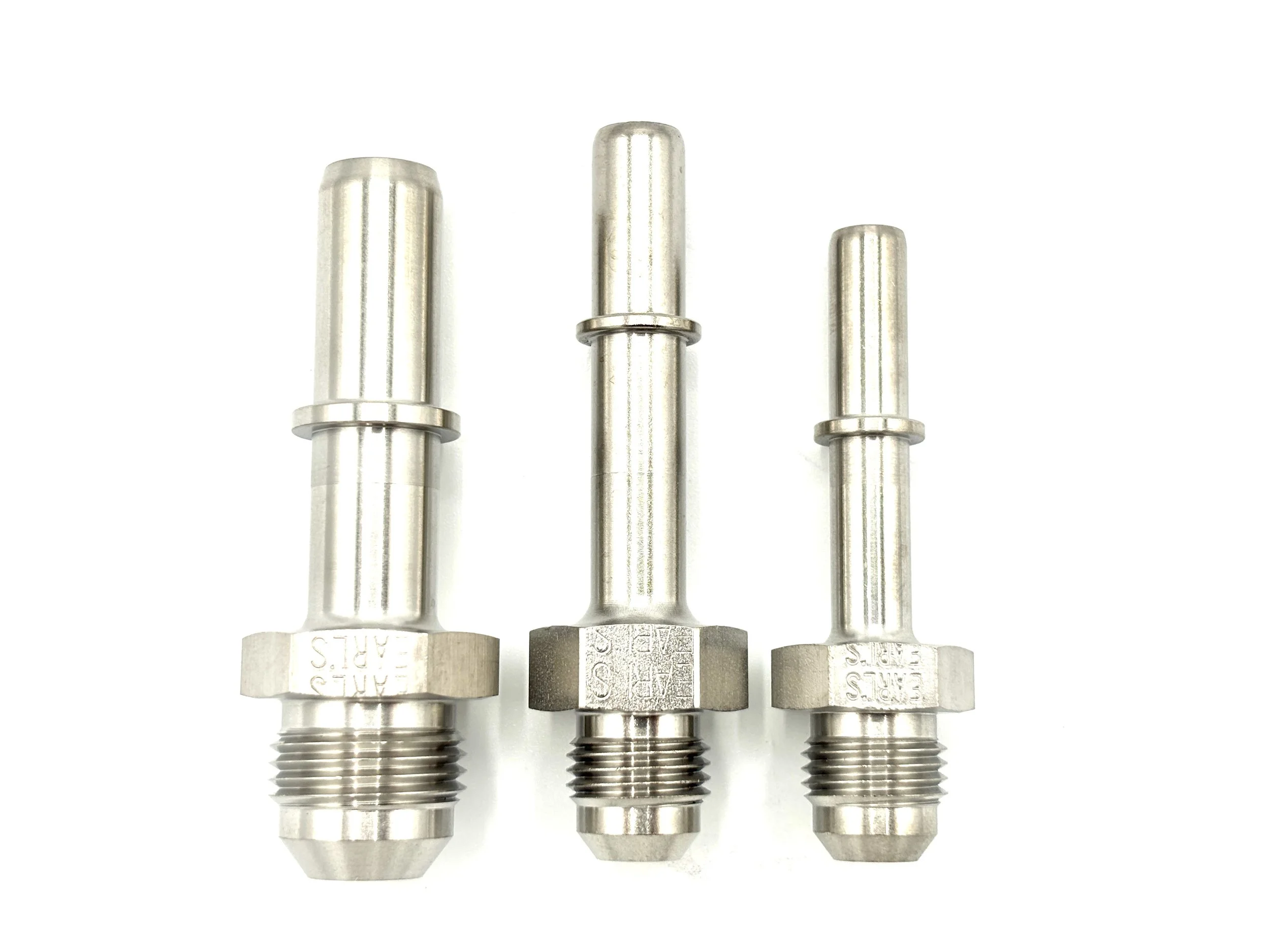 Earl's AN male to OE quick connect tube adapter. Silver in color. Various sizes from largest to smallest, left to right.