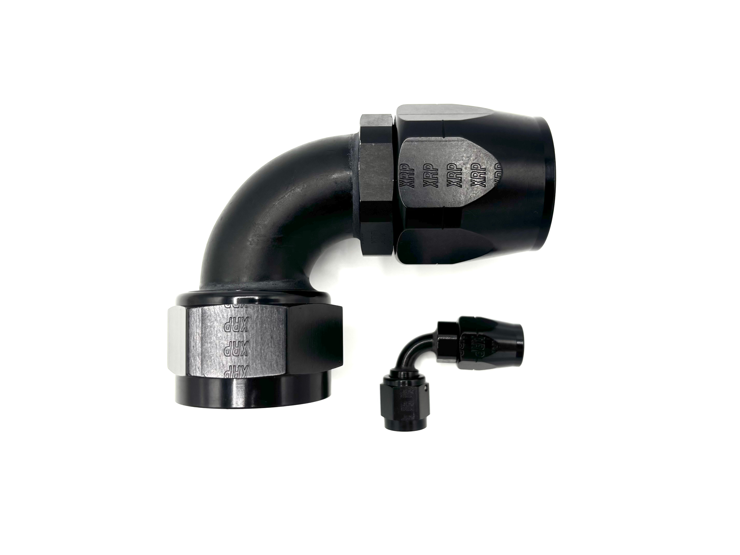 Two 90 degree AN fittings. One is much larger than the other. The bends are going towards the right.