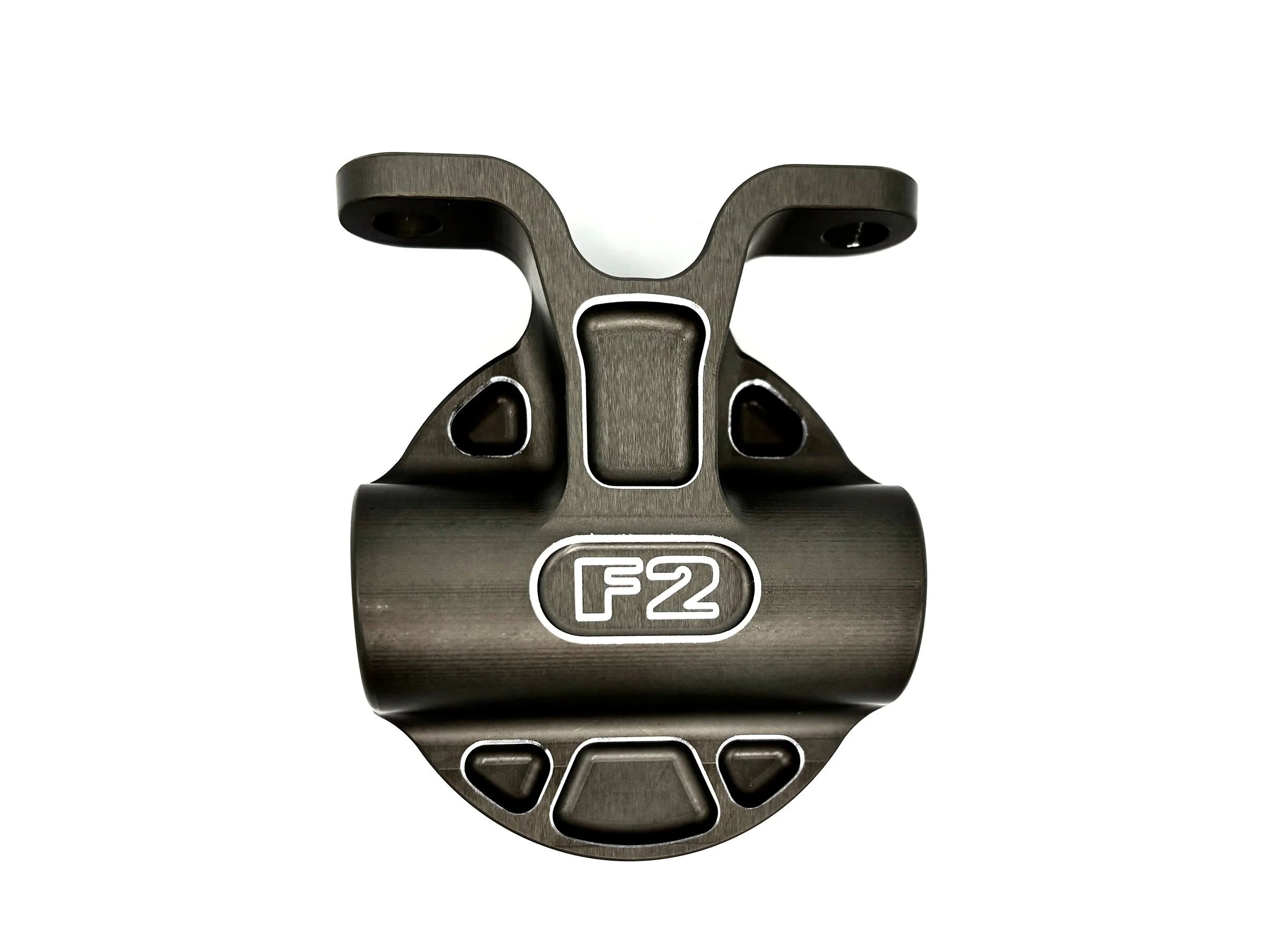 F2 Oil filter head. Top view. Finished in grey anodizing. Has F2 logo engraved in the top.