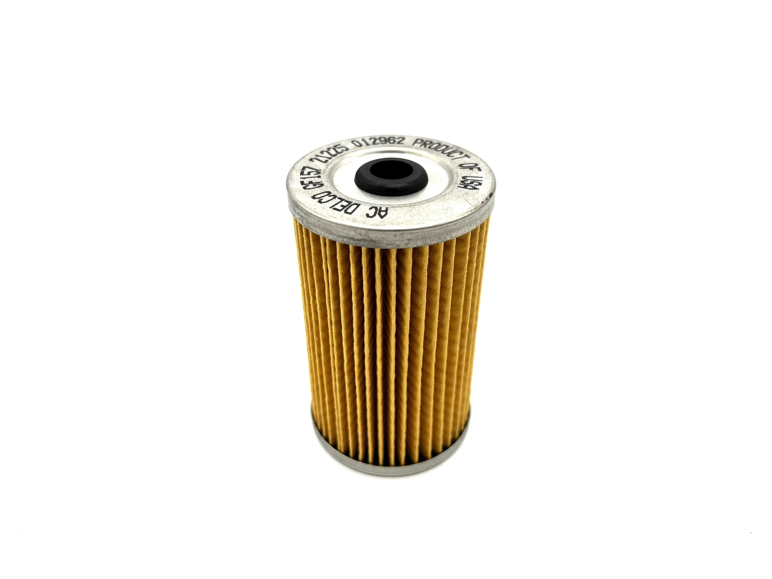 ACDelco Replacement Fuel Filter Element side view. Yellow paper in the middle with metal caps on both the top and bottom with a hole in the middle.