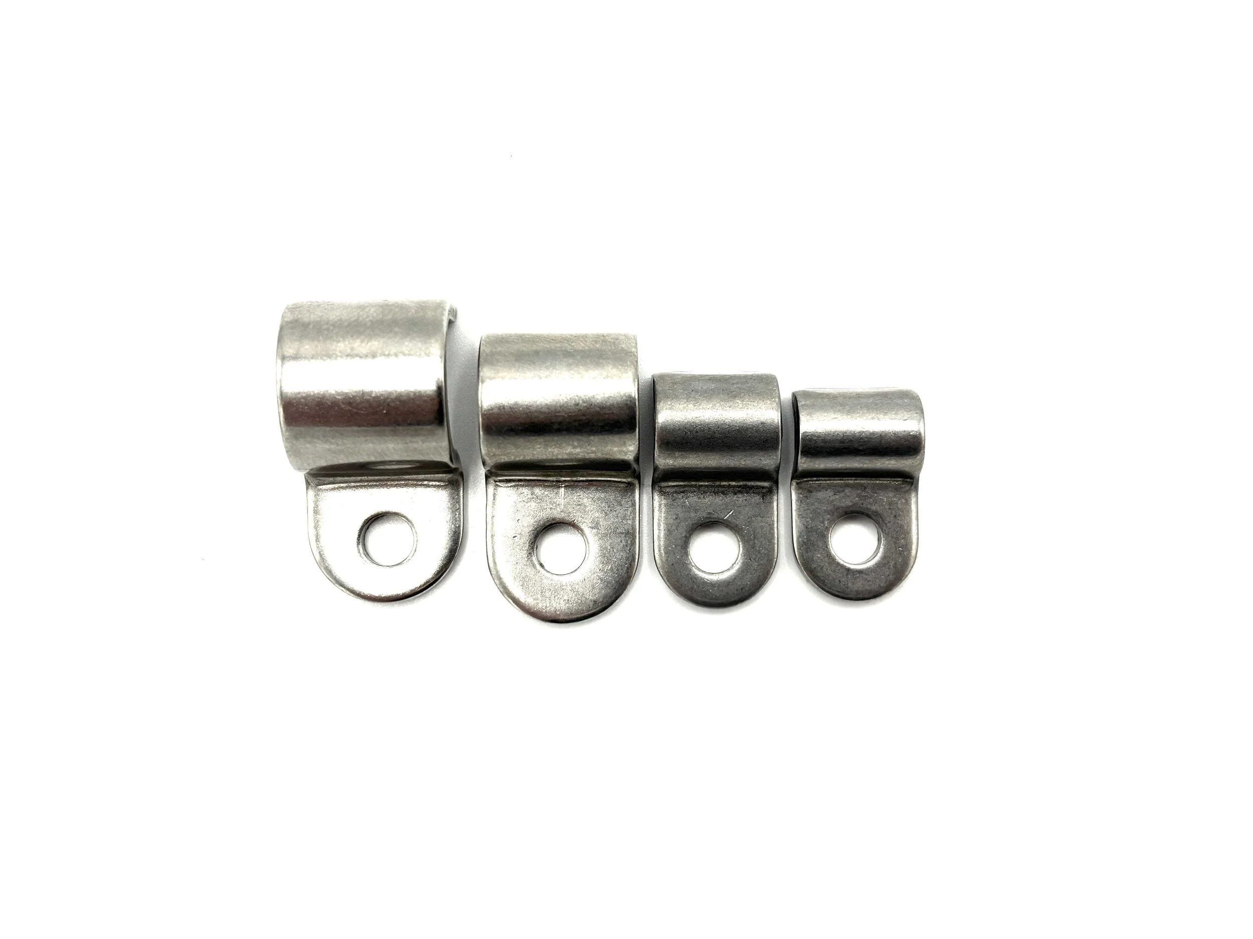 F2 stainless steel hard line clamp. Silver in color. Various sizes from largest to smallest, left to right.